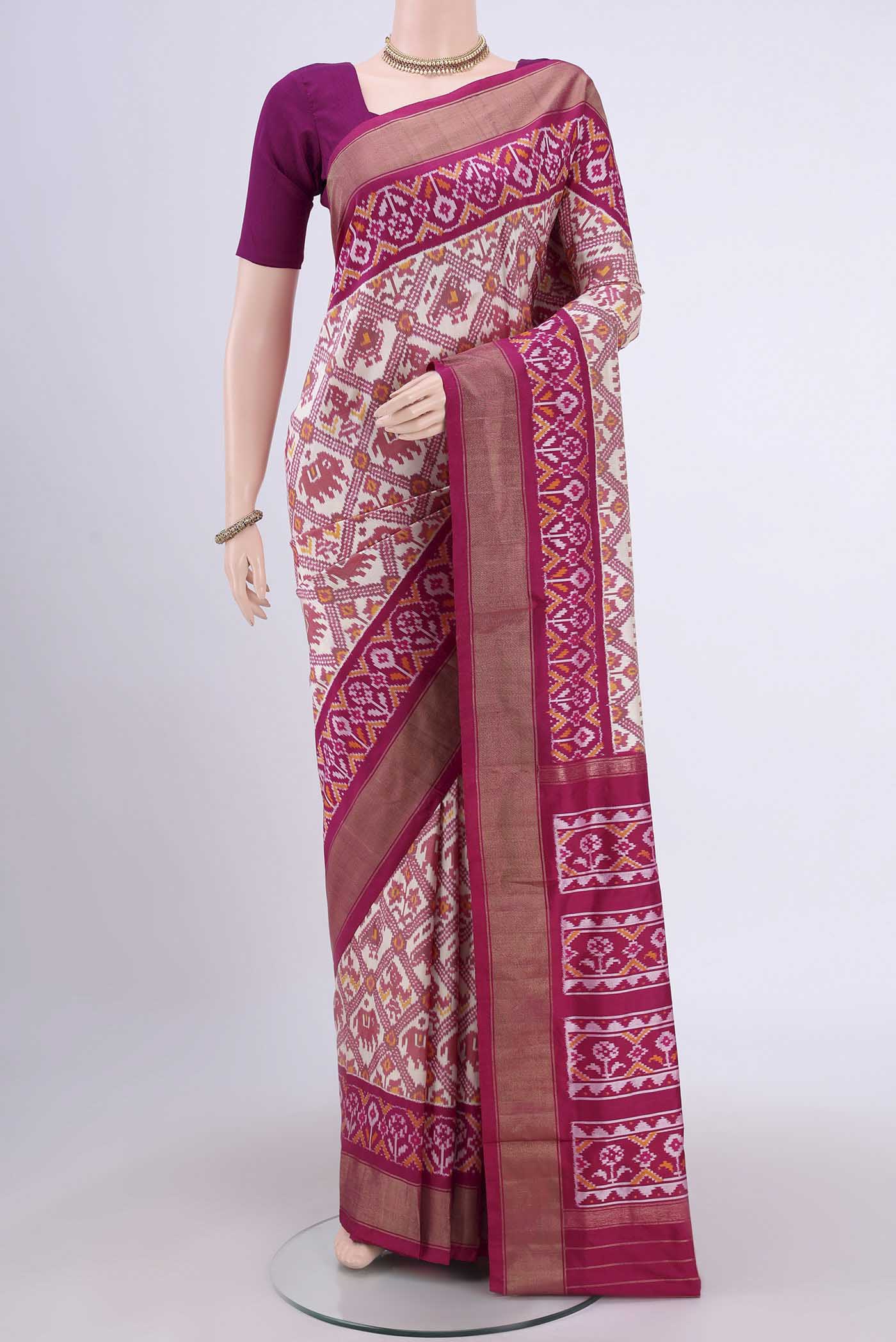 Off White Pochampally Silk Saree with Pure Ikat on the body and Zari Border.  displayed on a mannequin