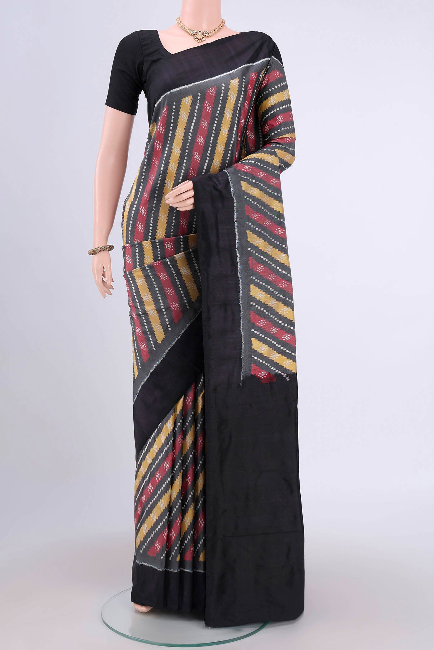 Davys Grey Pochampally Silk Saree with Pure Ikat on the body and Plain Border.  displayed on a mannequin