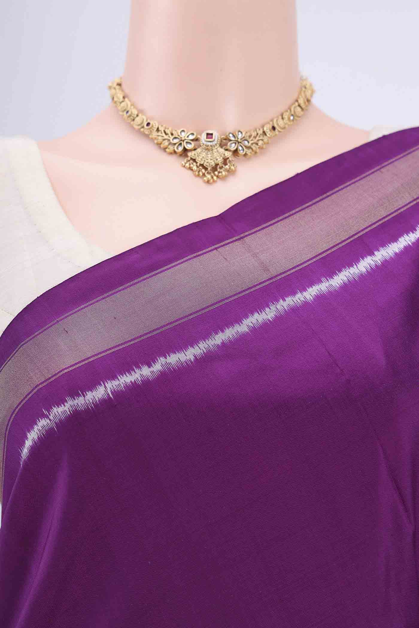Border image of Purple Pochampally Silk Saree with Pure Ikat on the body and Zari Border. 