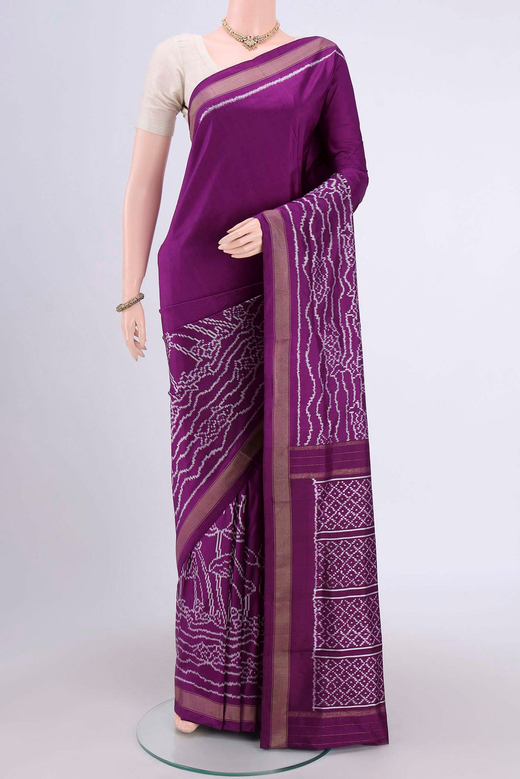 Purple Pochampally Silk Saree with Pure Ikat on the body and Zari Border.  displayed on a mannequin