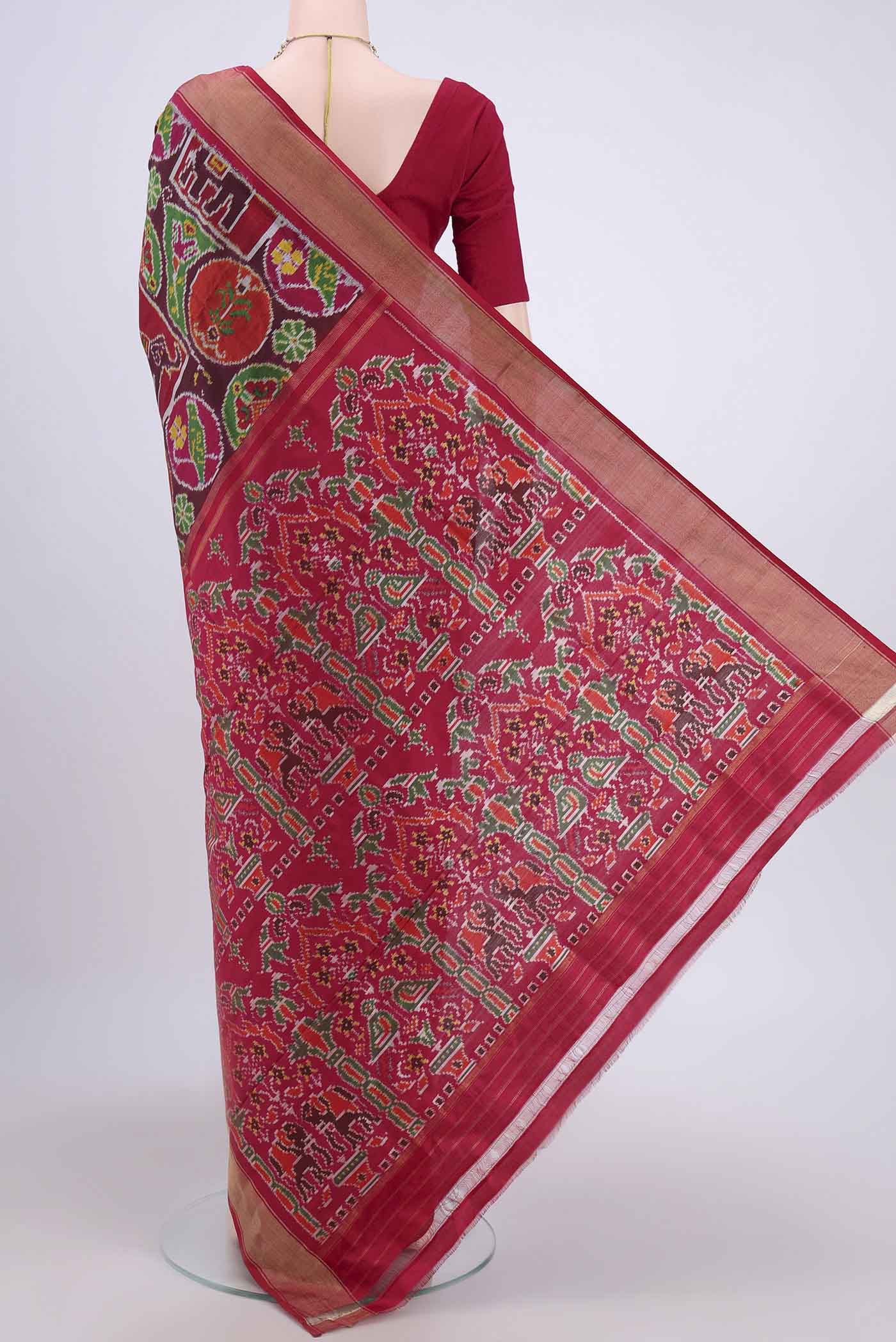 Flat view of Brown Pochampally Silk Saree with Pure Ikat on the body and Zari Border. 