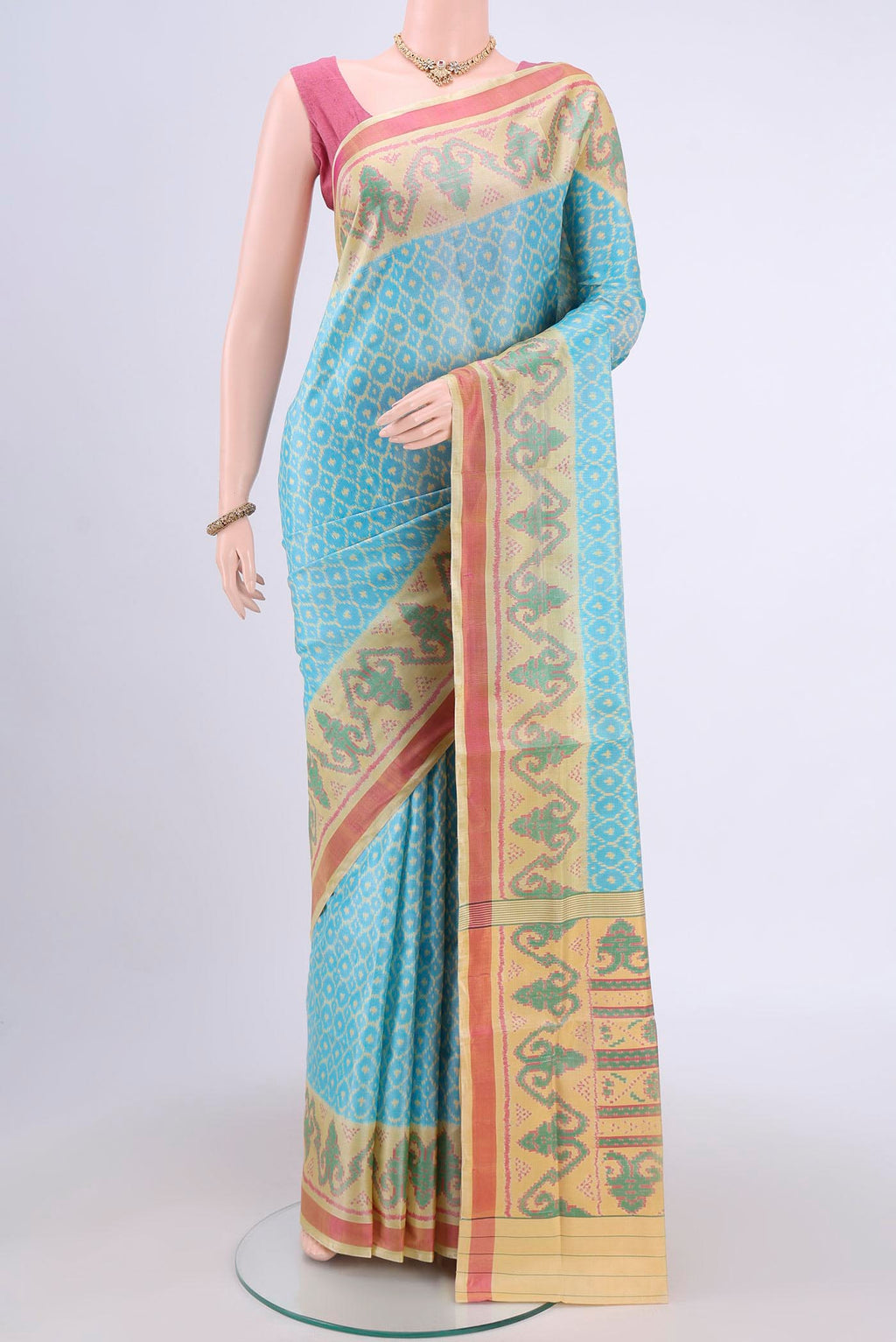 Sky Blue Rajkot Patola Silk Saree with Pure Ikat on the body and Fancy Border.  displayed on a mannequin