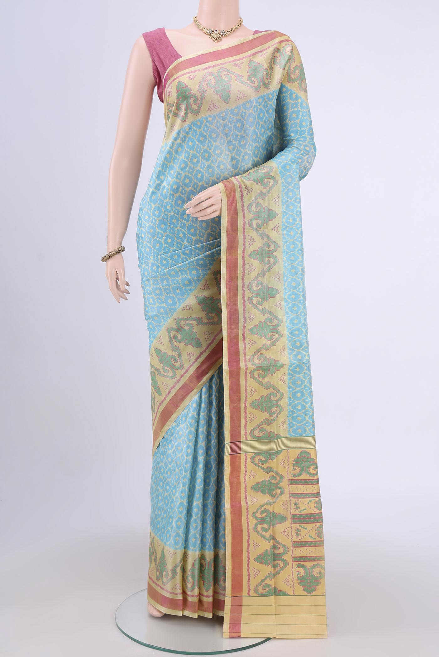 Sky Blue Rajkot Patola Silk Saree with Pure Ikat on the body and Fancy Border.  displayed on a mannequin