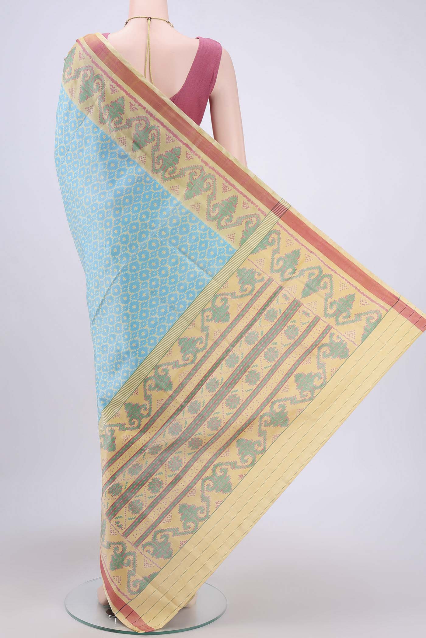 Flat view of Sky Blue Rajkot Patola Silk Saree with Pure Ikat on the body and Fancy Border. 