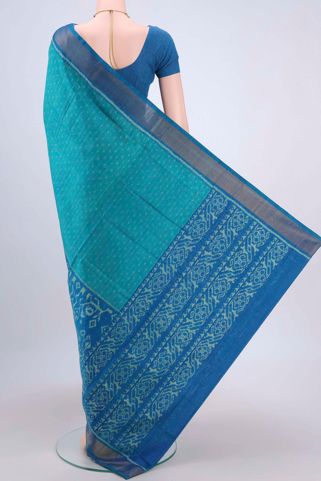 Flat view of Sea Green Rajkot Patola Silk Saree with Pure Ikat on the body and Zari Border. 