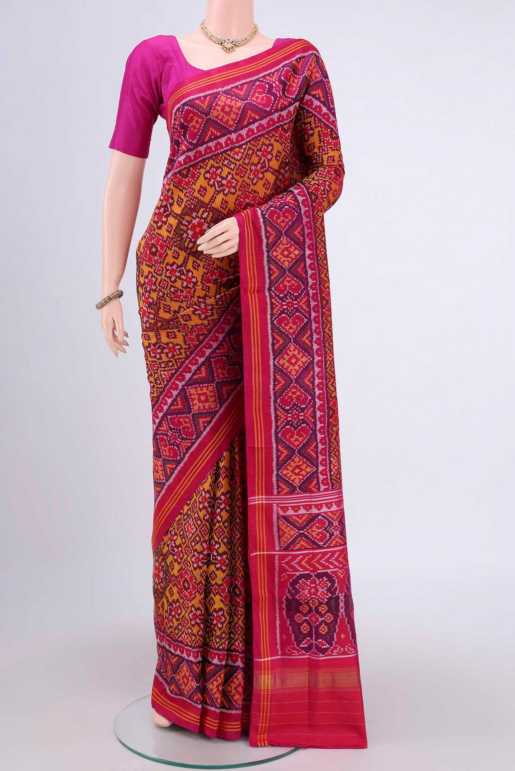 Multi Color Rajkot Patola Silk Saree with Pure Ikat on the body and Zari Border.  displayed on a mannequin