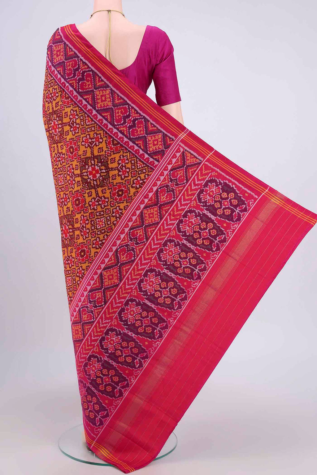 Flat view of Multi Color Rajkot Patola Silk Saree with Pure Ikat on the body and Zari Border. 