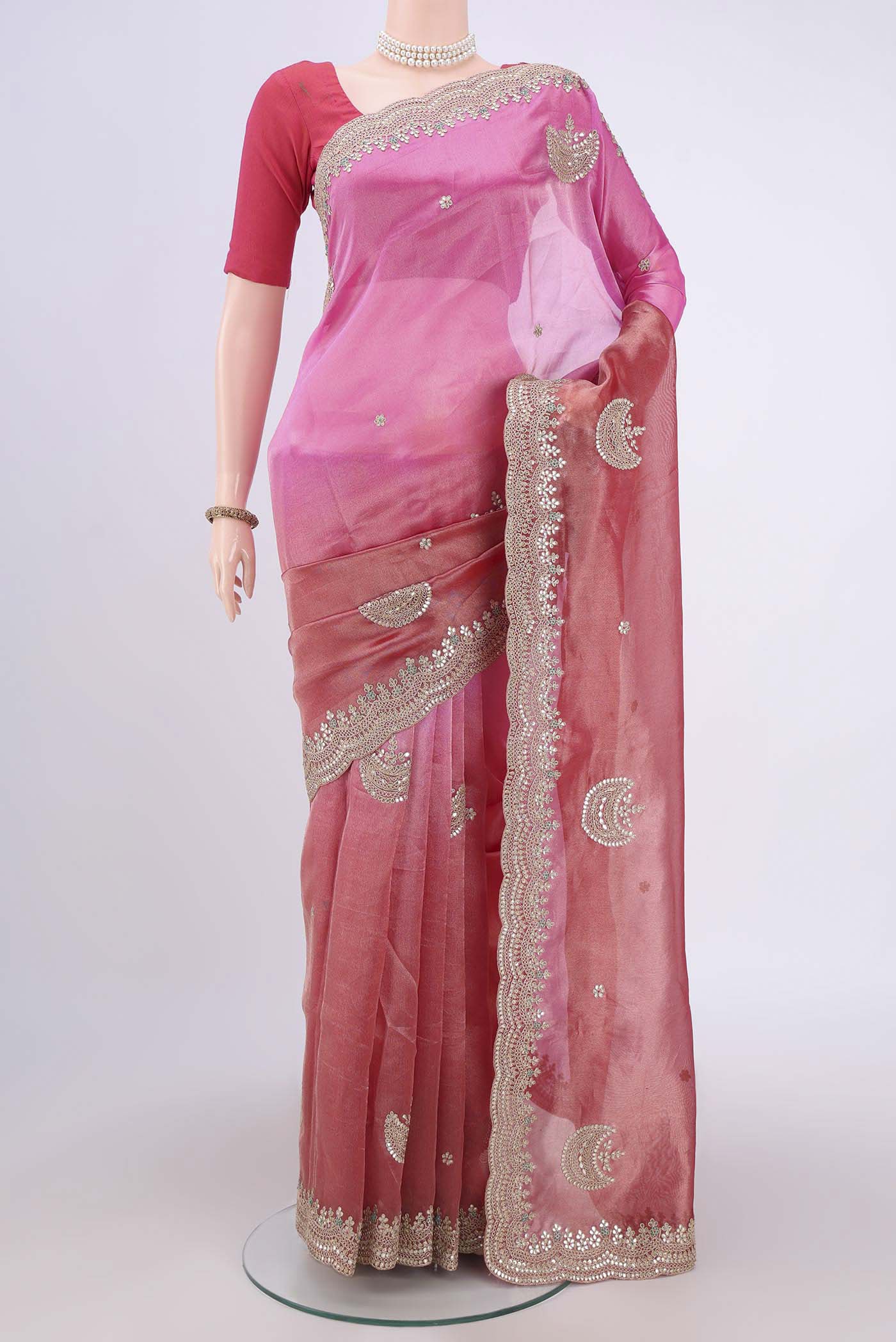 Multi Color Organza Silk Saree with Embroidery on the body and Zari Border.  displayed on a mannequin