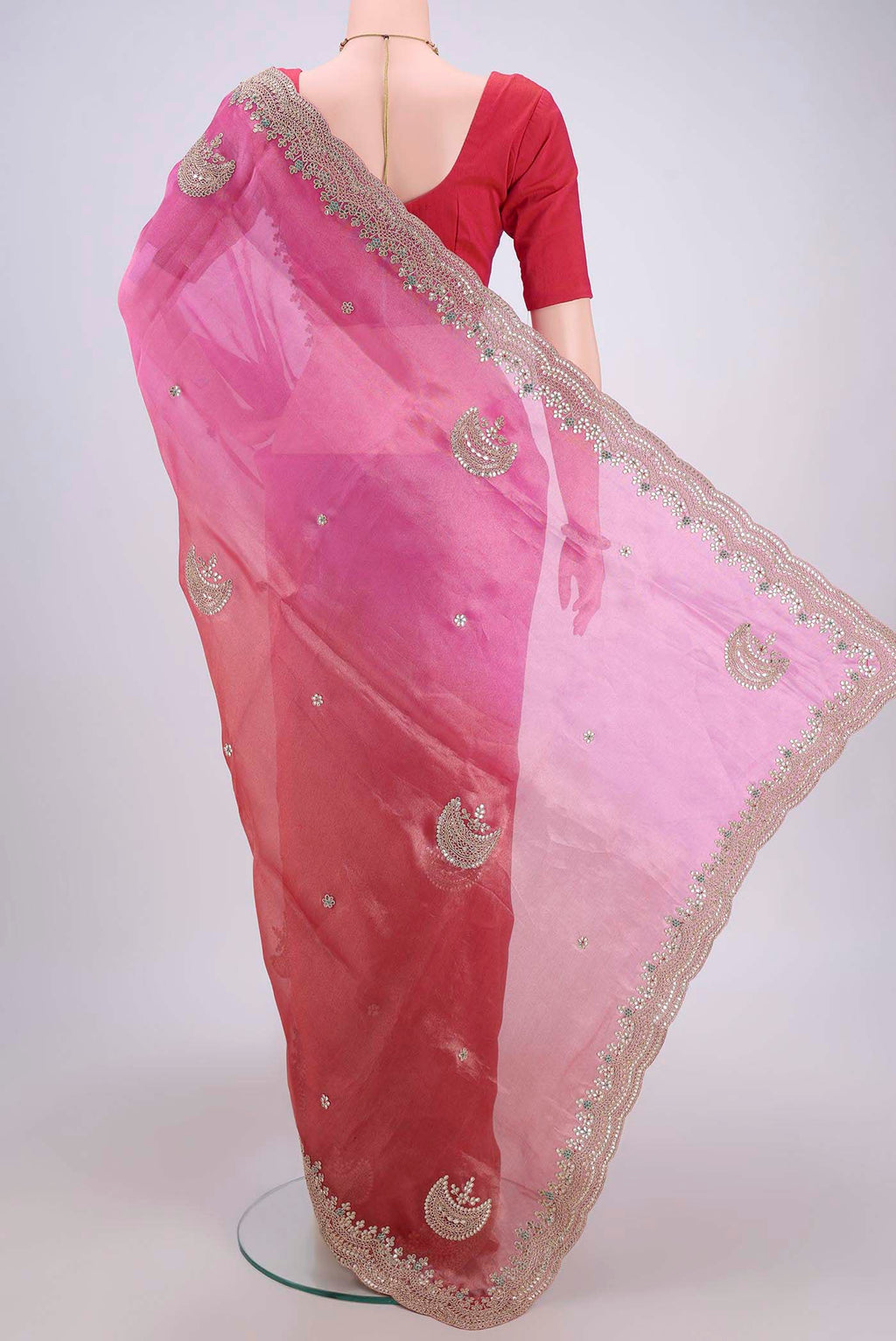 Flat view of Multi Color Organza Silk Saree with Embroidery on the body and Zari Border. 