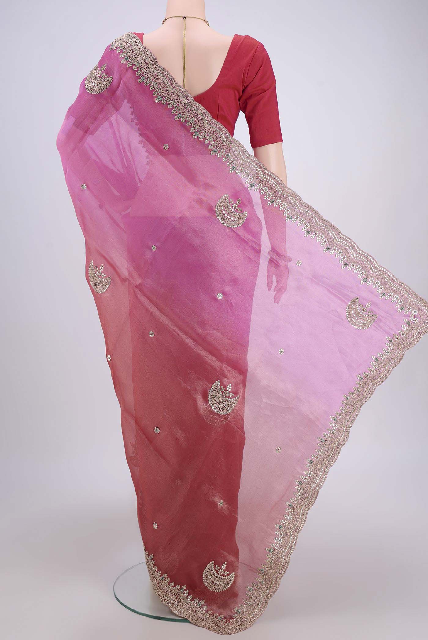 Flat view of Multi Color Organza Silk Saree with Embroidery on the body and Zari Border. 