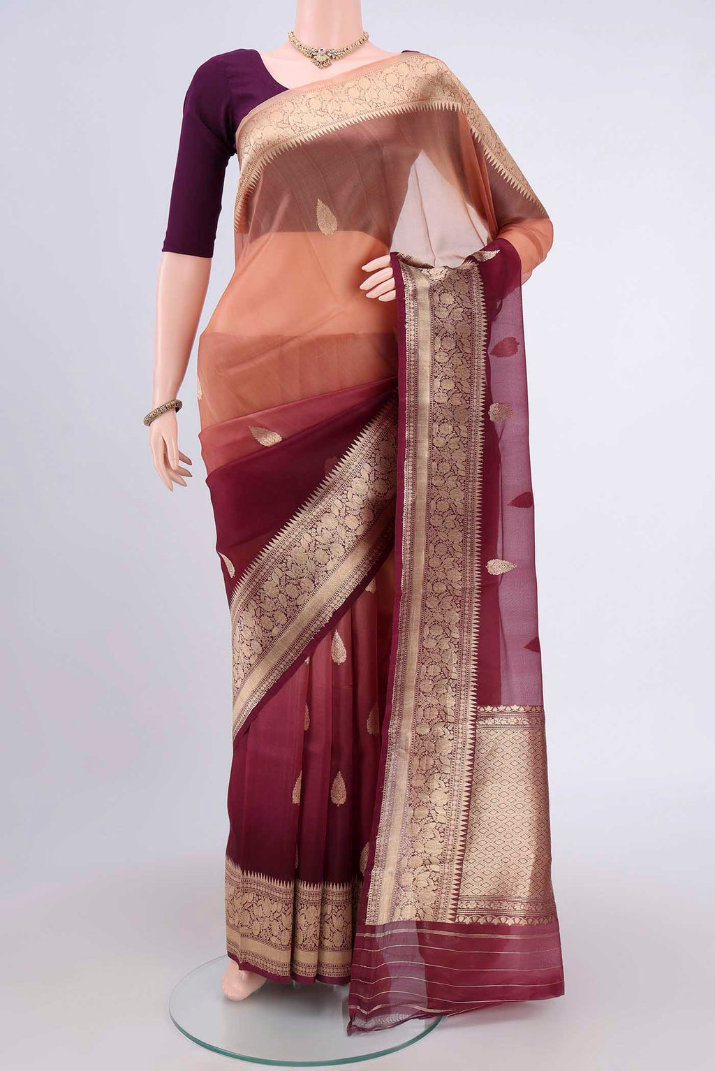 Burgundy Organza Silk Saree with Half And Half on the body and Zari Border.  displayed on a mannequin