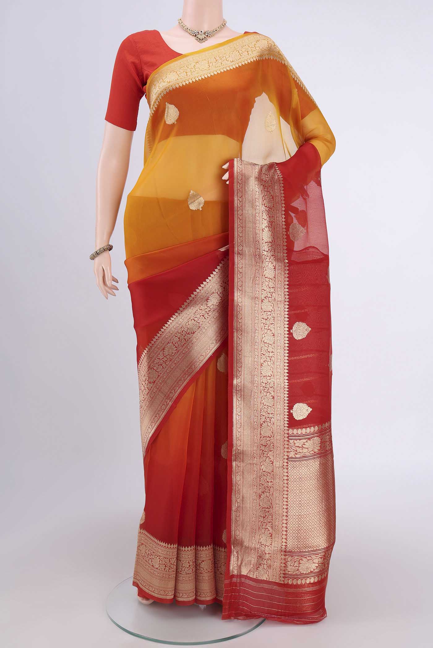 Rust Organza Silk Saree with Half And Half on the body and Zari Border.  displayed on a mannequin