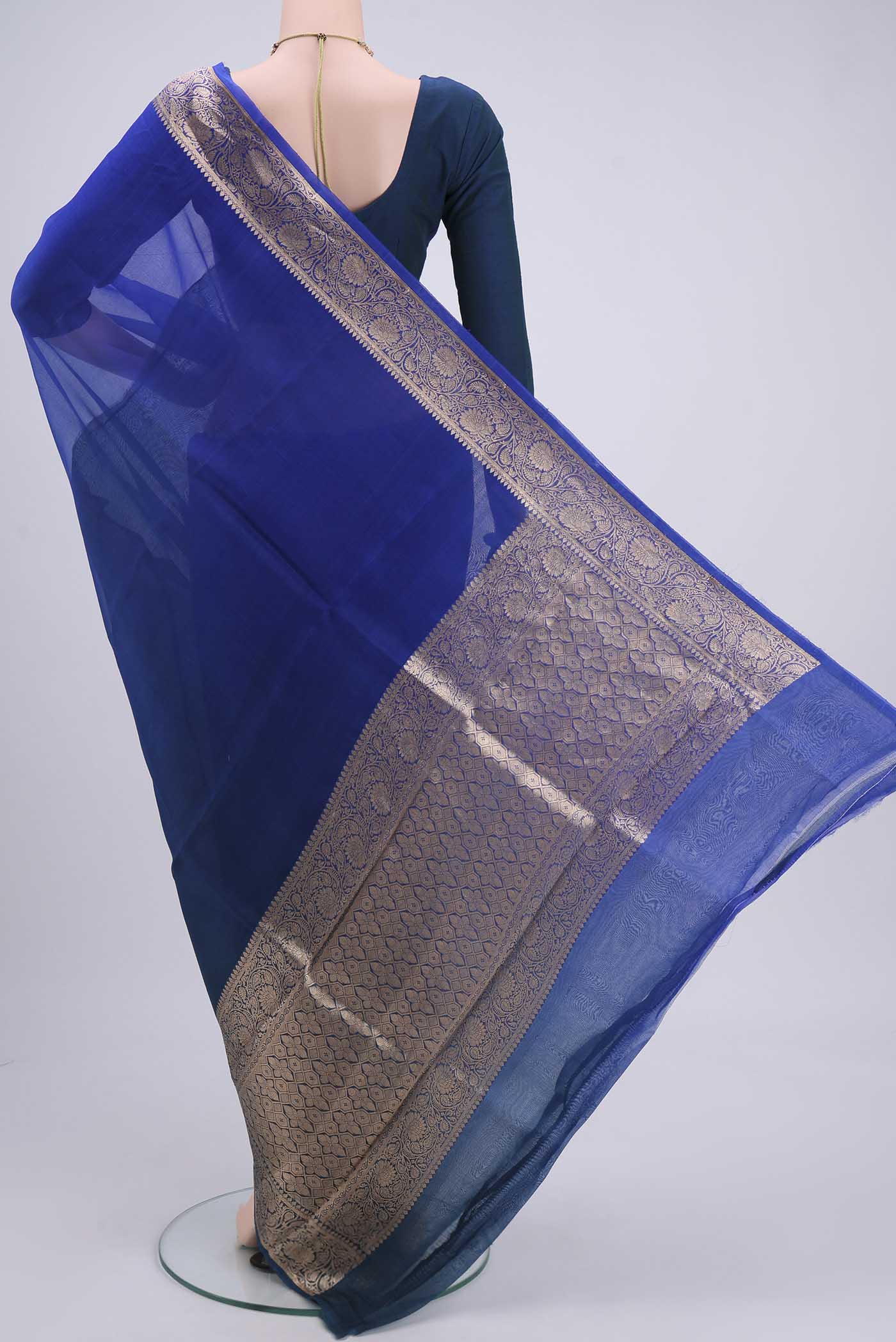 Flat view of Royal Blue Organza Silk Saree with Plain Body and Zari Border. 