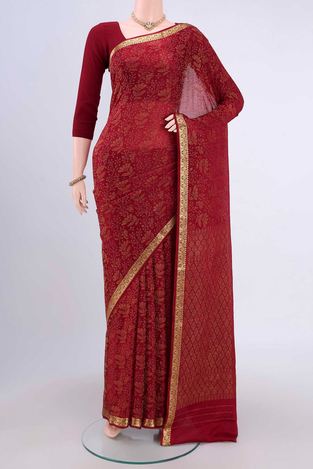Maroon Mysore Crepe Saree with Zari Brocade on the body and Zari Border.  displayed on a mannequin