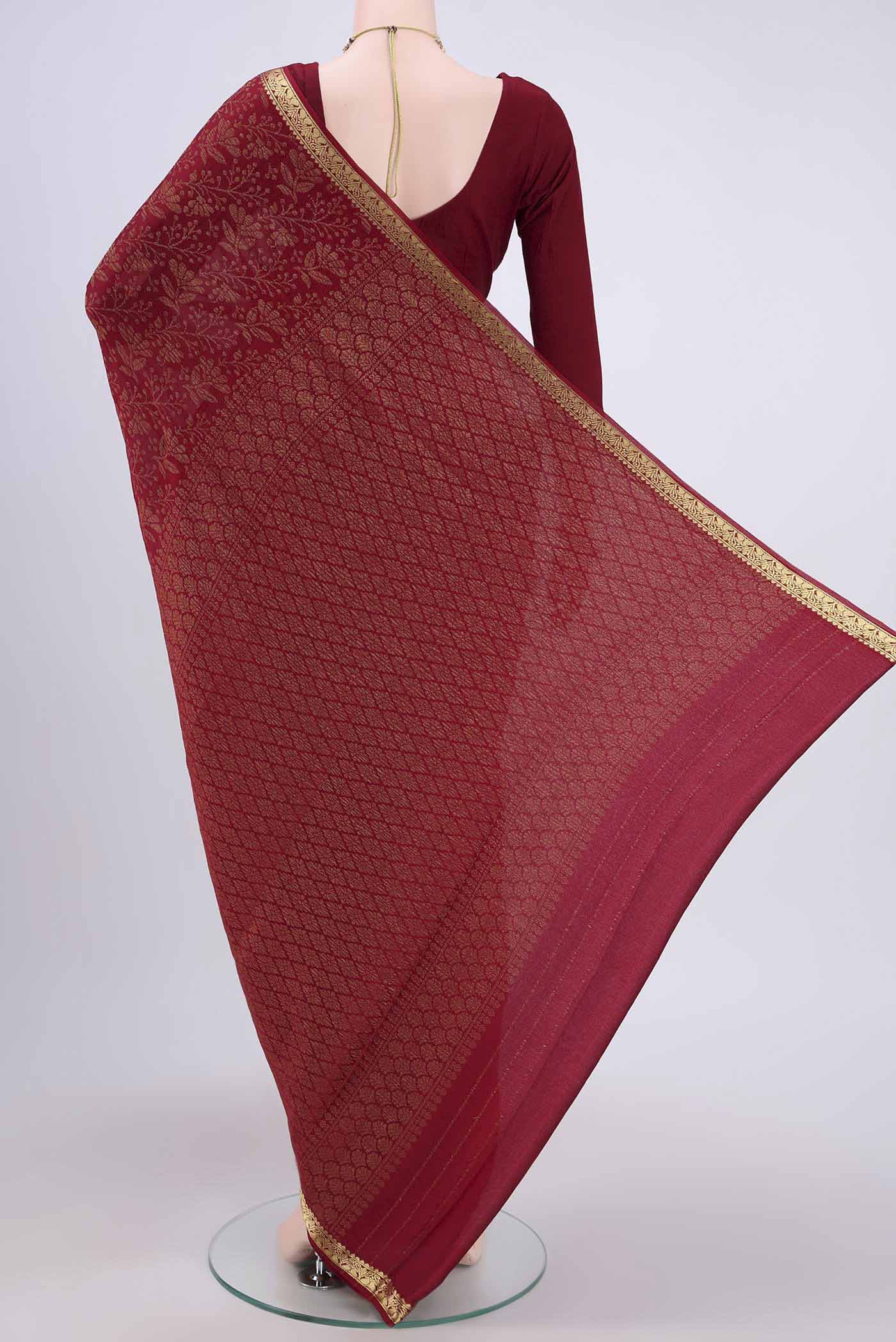 Flat view of Maroon Mysore Crepe Saree with Zari Brocade on the body and Zari Border. 