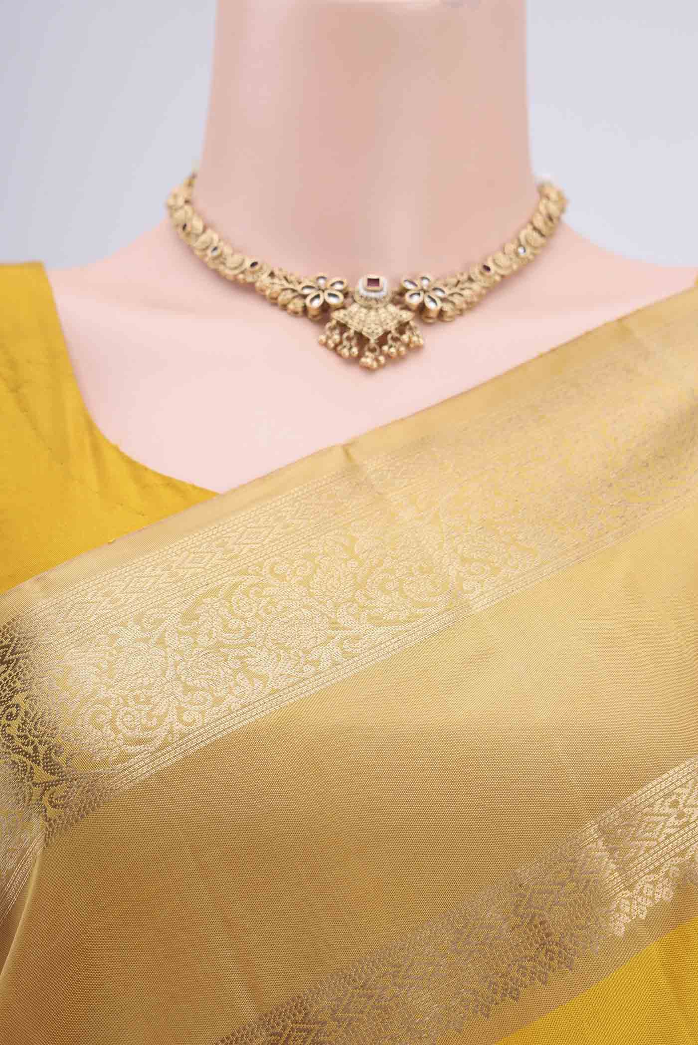 Border image of Yellow Dual Tone Soft Silk Saree with Plain Body and Zari Border. 
