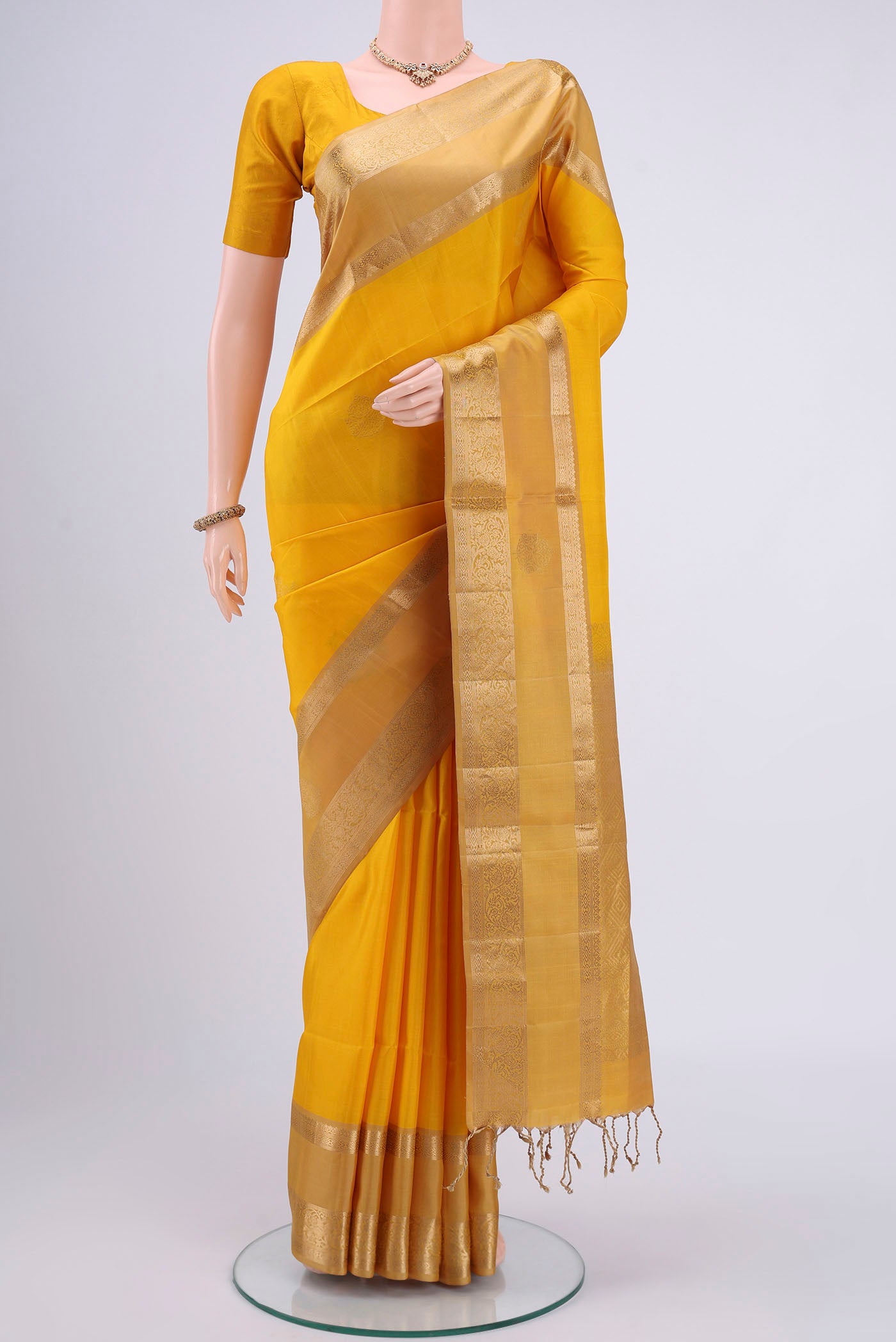 Yellow Dual Tone Soft Silk Saree with Plain Body and Zari Border.  displayed on a mannequin