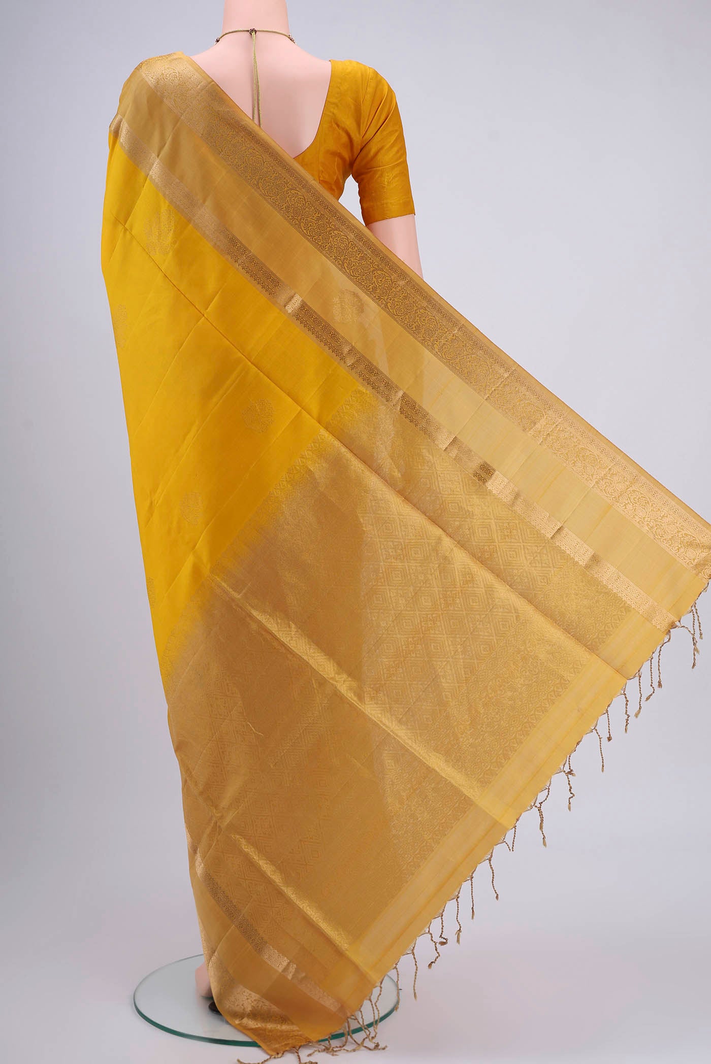 Flat view of Yellow Dual Tone Soft Silk Saree with Plain Body and Zari Border. 