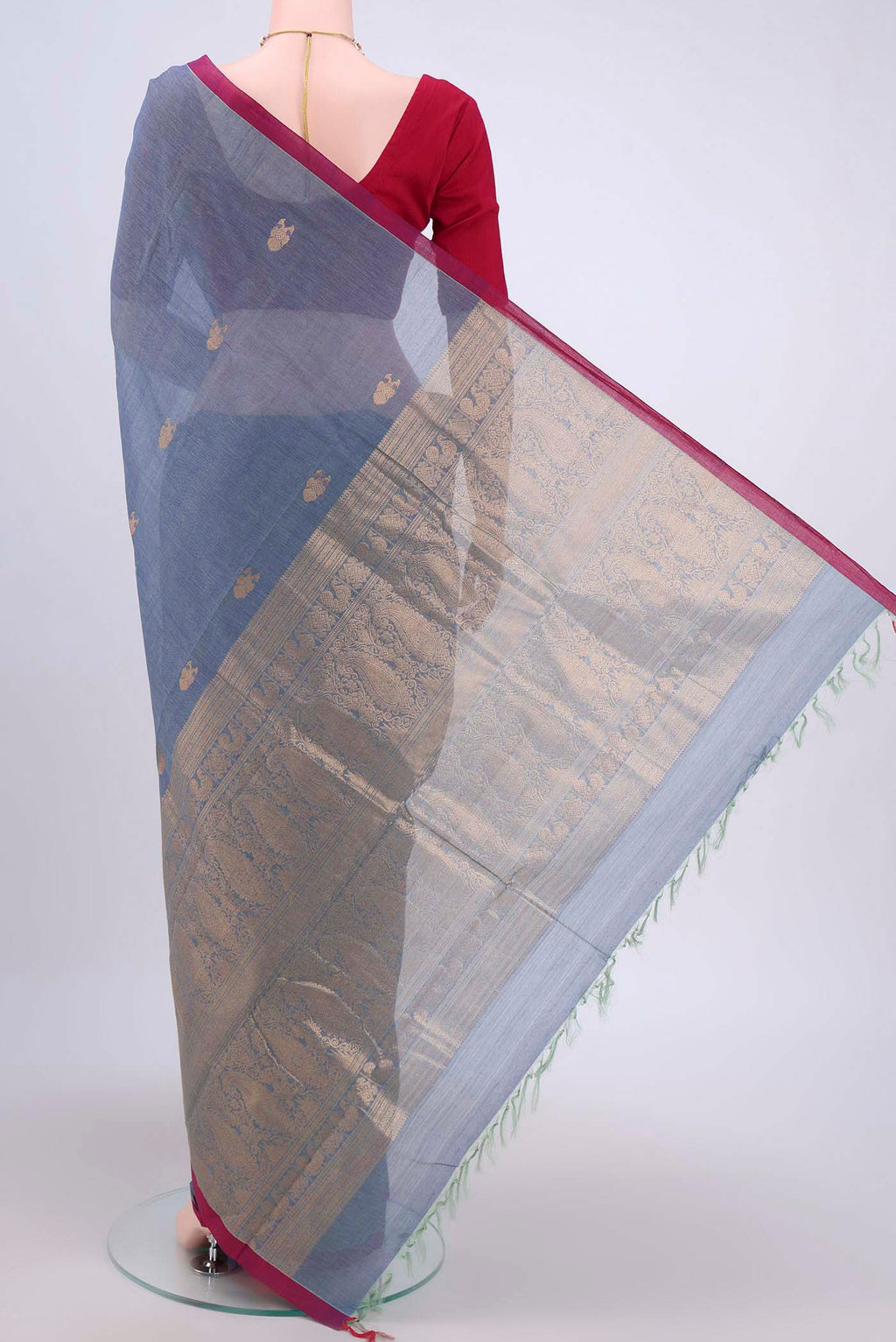 Flat view of Sky Blue Kanchi Cotton Saree with Zari Butta on the body and Zari Border. 