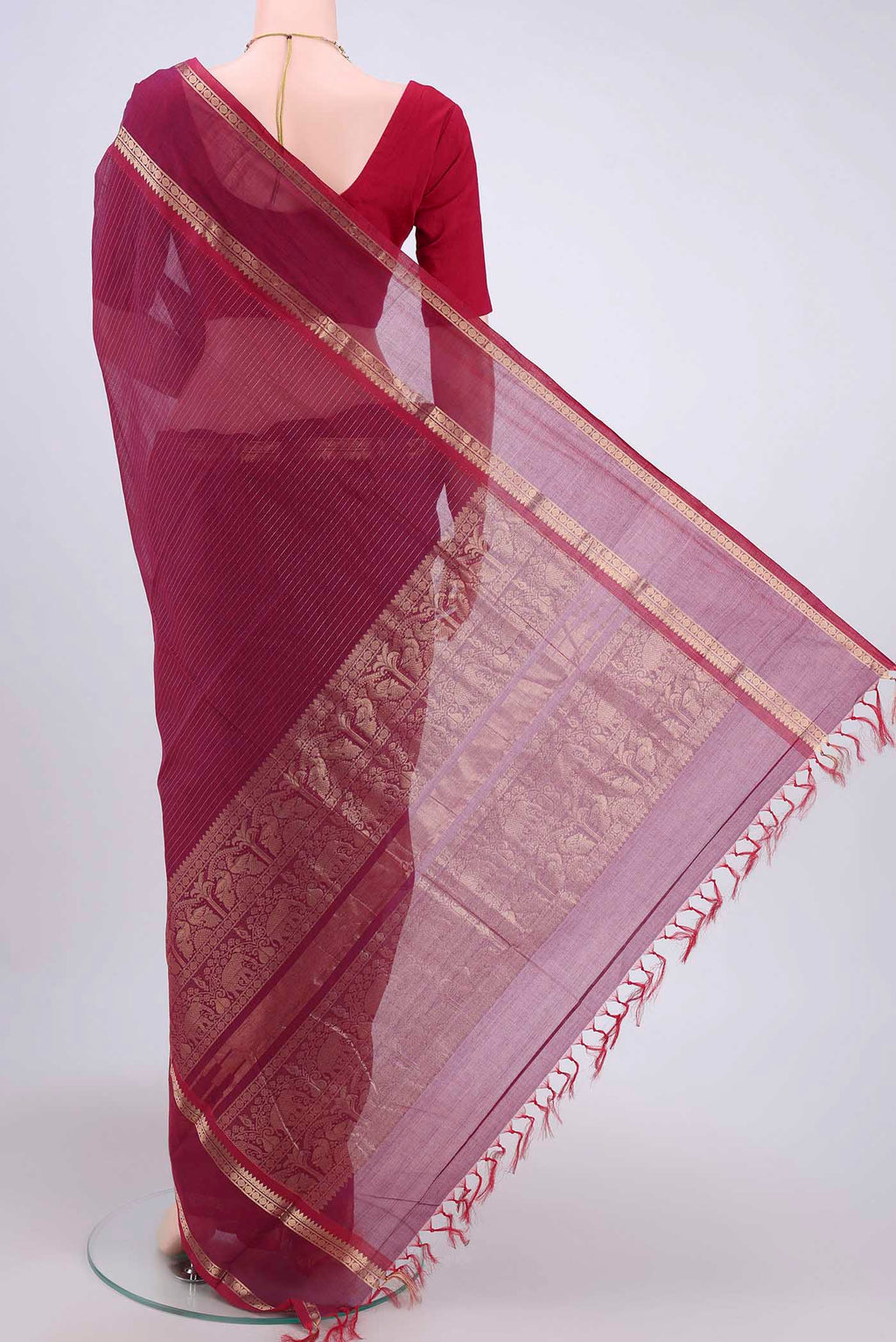 Flat view of Dark Pink Kanchi Cotton Saree with Stripes on the body and Zari Border. 