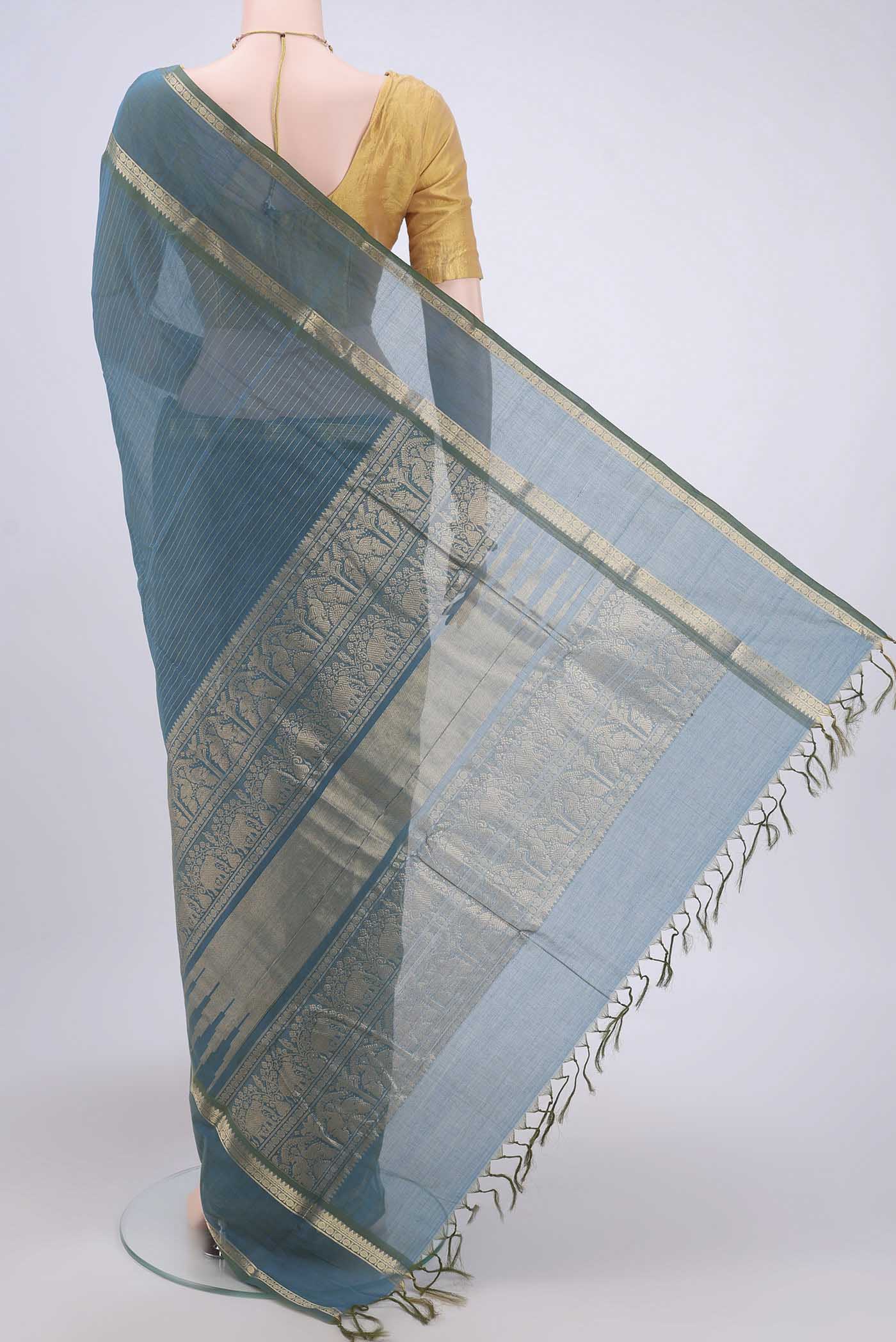 Flat view of Green Kanchi Cotton Saree with Stripes on the body and Zari Border. 