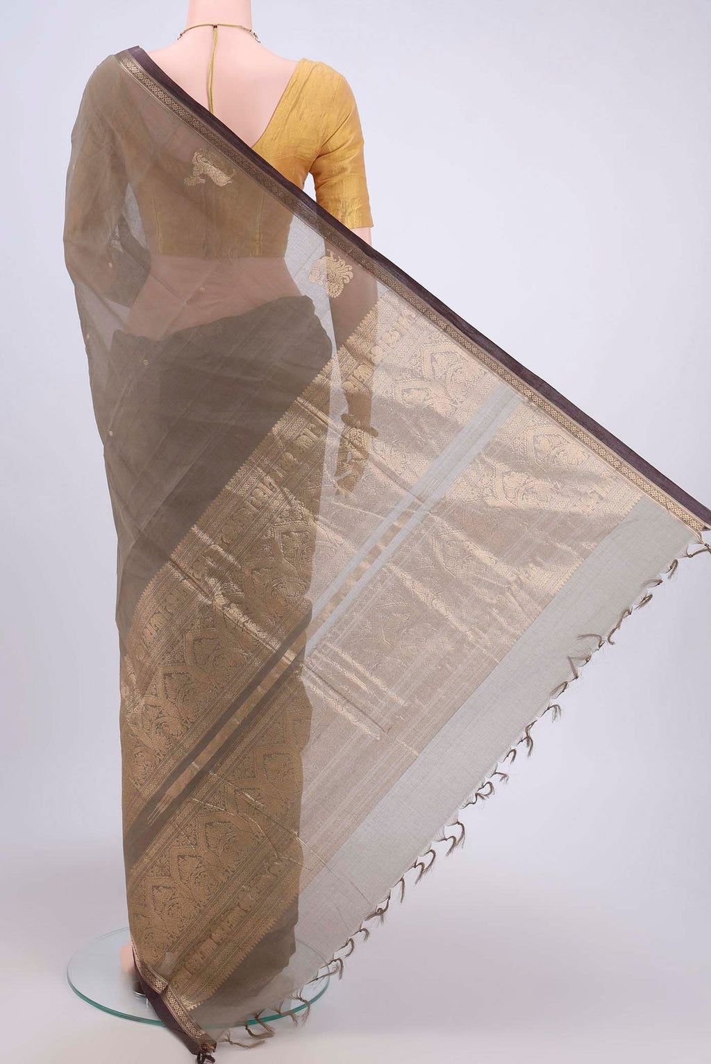 Flat view of Davys Grey Kanchi Cotton Saree with Zari Butta on the body and Zari Border. 