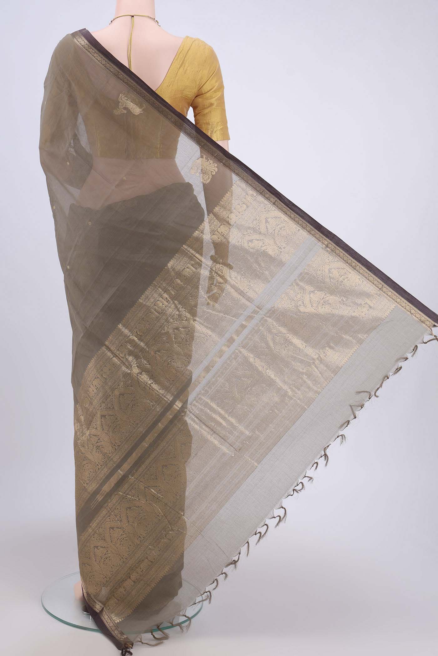 Flat view of Davys Grey Kanchi Cotton Saree with Zari Butta on the body and Zari Border. 