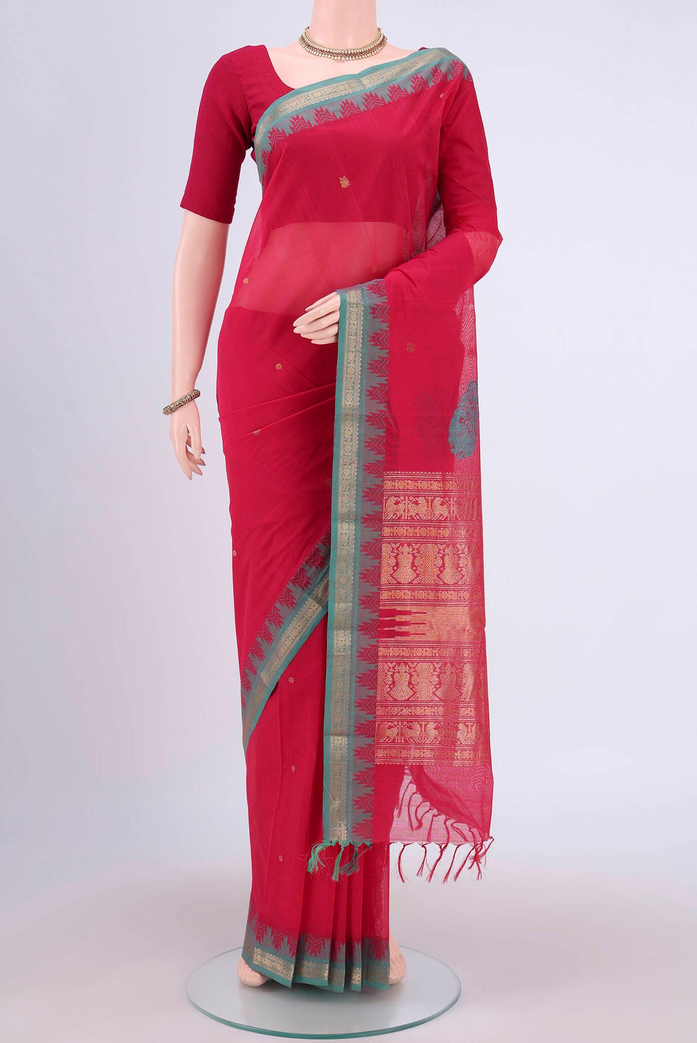 Dark Pink Kanchi Cotton Saree with Zari Butta on the body and Zari Border.  displayed on a mannequin