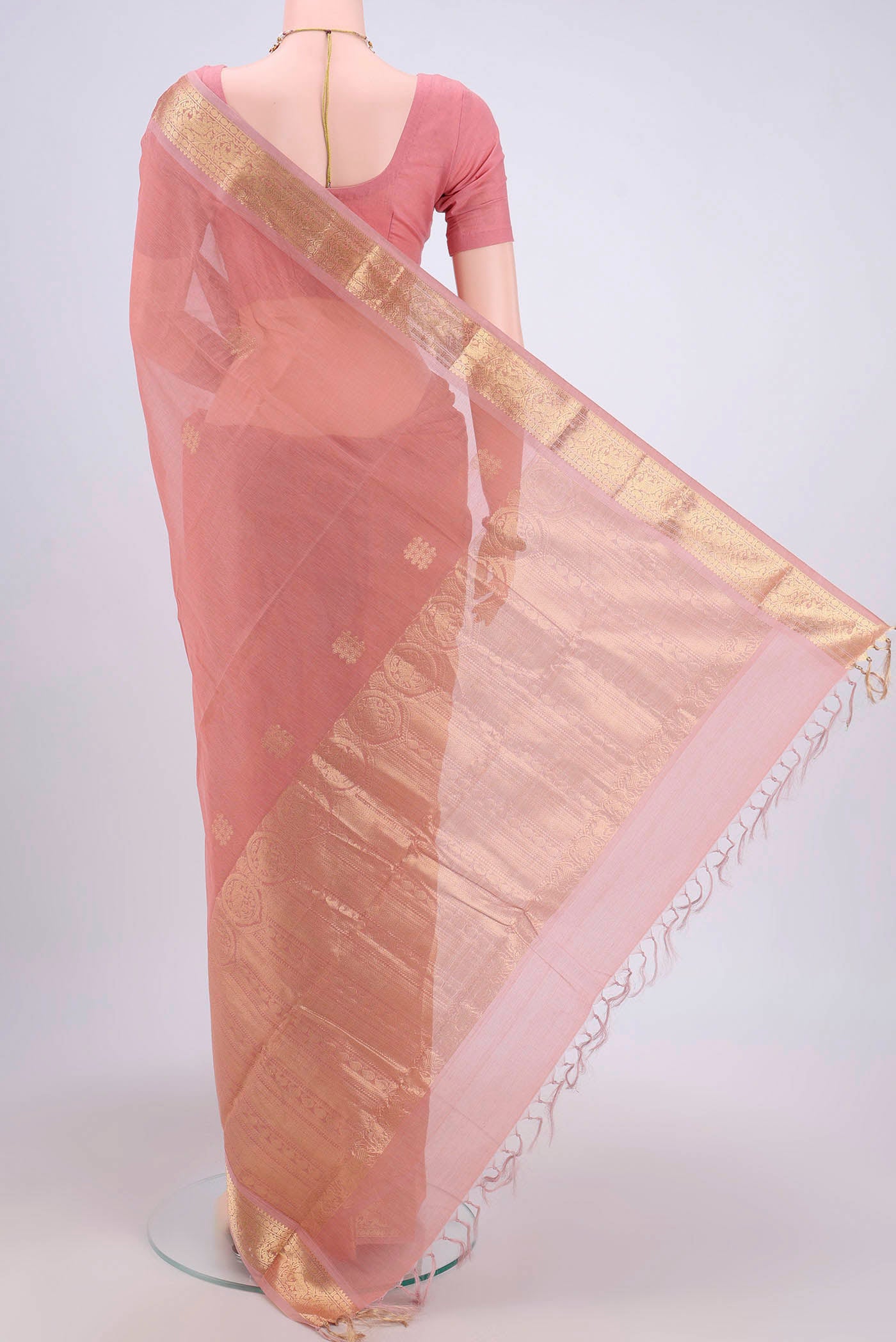Flat view of Peach Kanchi Cotton Saree with Zari Butta on the body and Zari Border. 