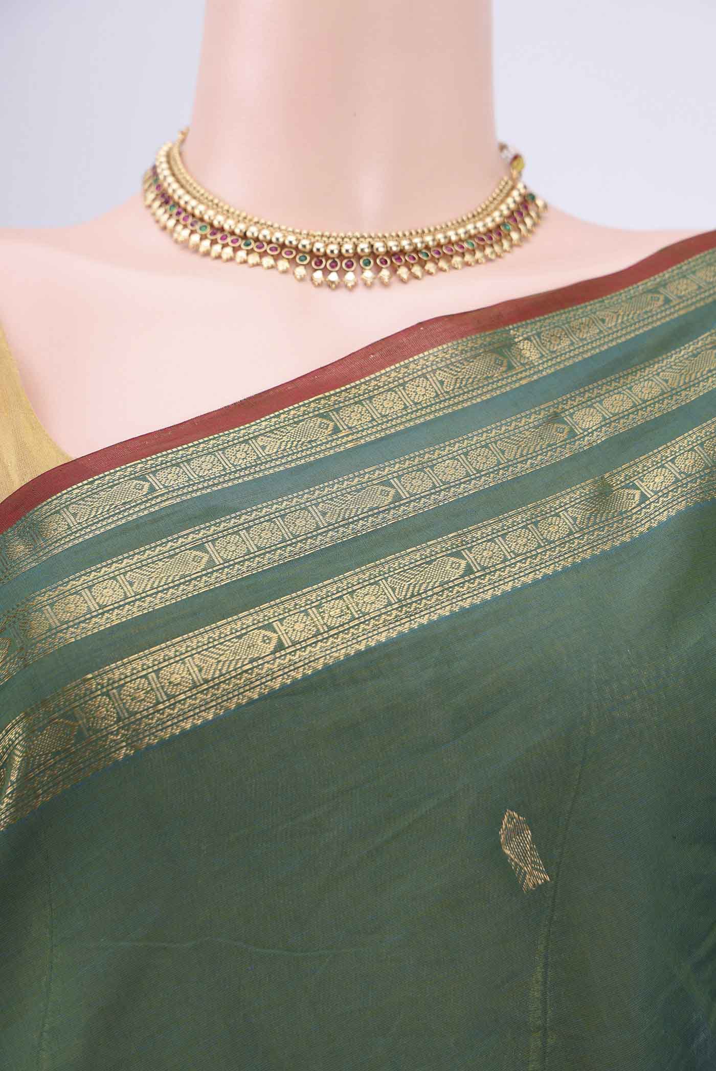 Border image of Green Kanchi Cotton Saree with Zari Butta on the body and Zari Border. 