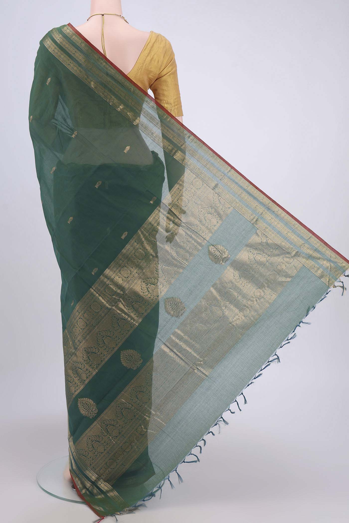 Flat view of Green Kanchi Cotton Saree with Zari Butta on the body and Zari Border. 