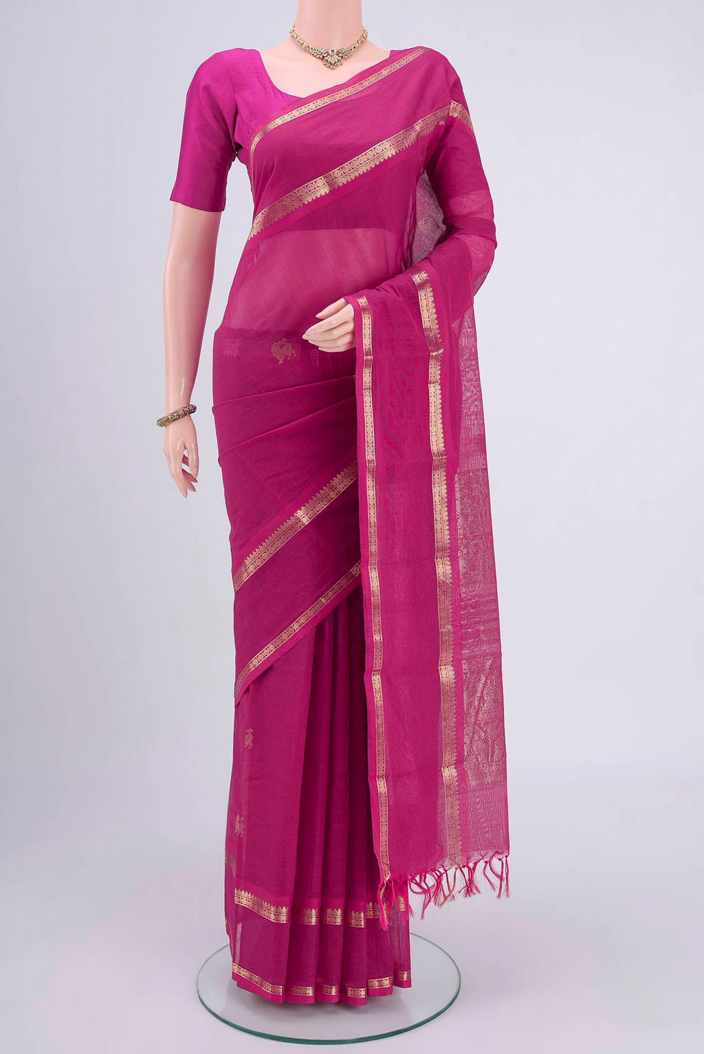 Dark Pink Kanchi Cotton Saree with Plain Body and Zari Border.  displayed on a mannequin