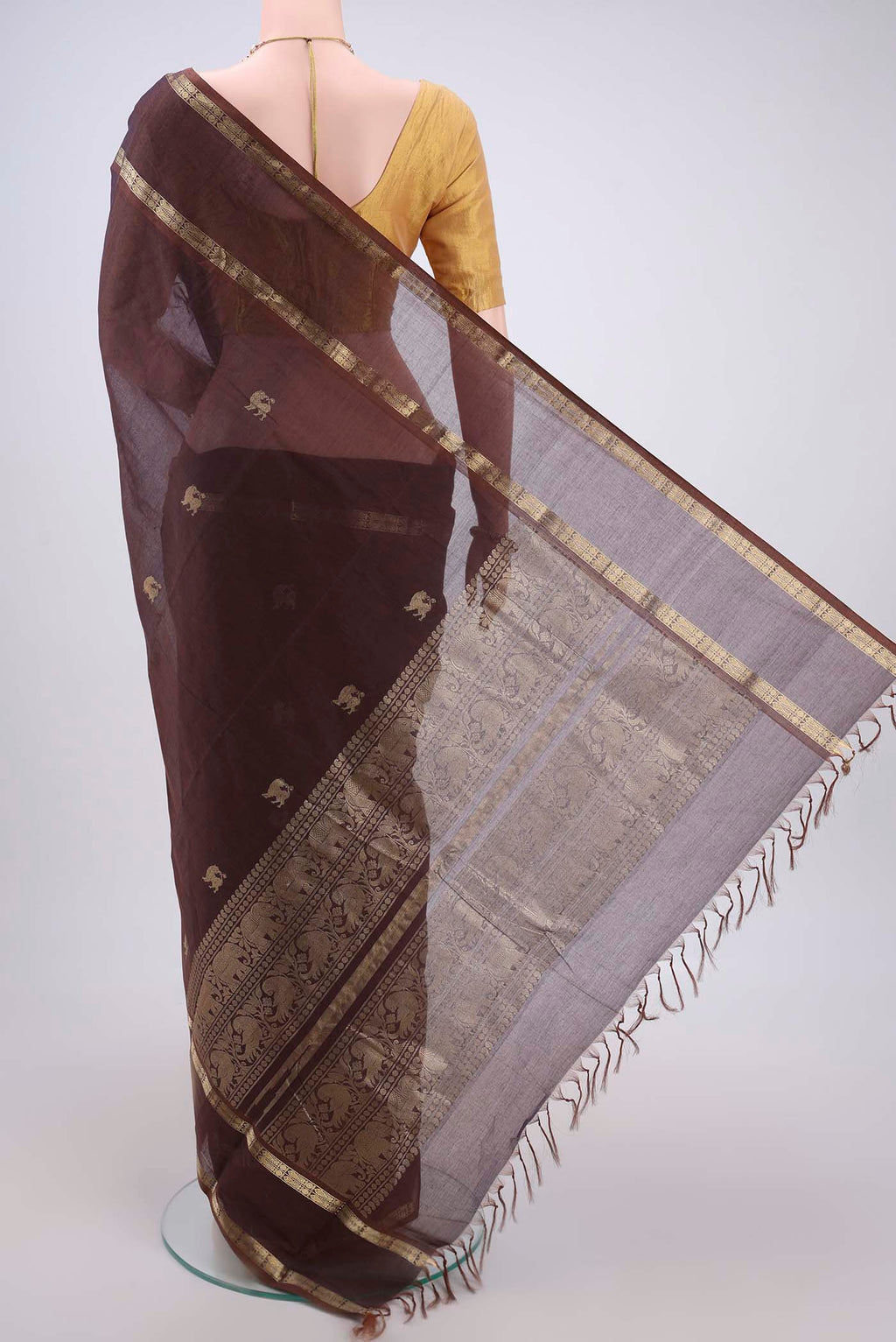 Flat view of Brown Kanchi Cotton Saree with Plain Body and Zari Border. 