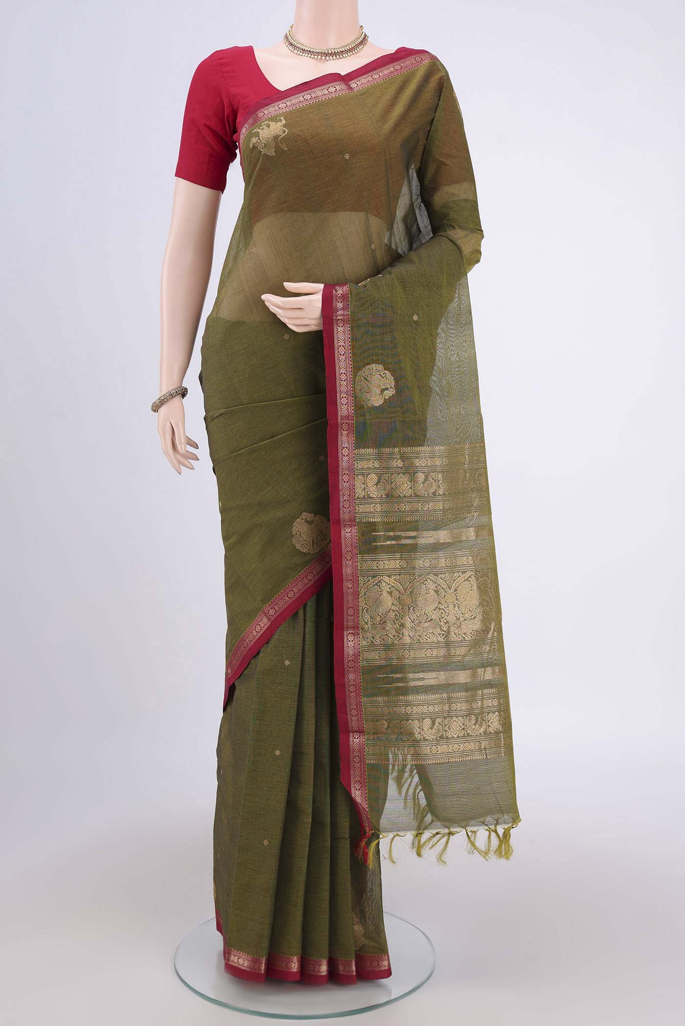 Mehandi Green Kanchi Cotton Saree with Plain Body and Zari Border.  displayed on a mannequin