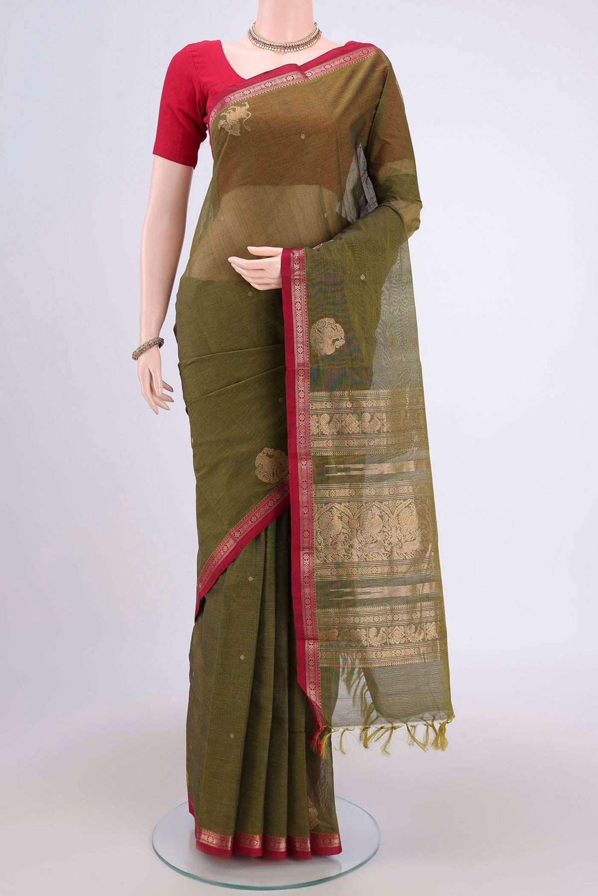 Mehandi Green Kanchi Cotton Saree with Plain Body and Zari Border.  displayed on a mannequin