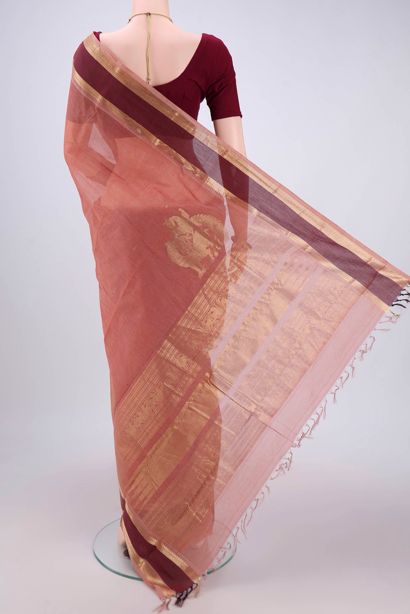 Flat view of Coral Kanchi Cotton Saree with Plain Body and Zari Border. 