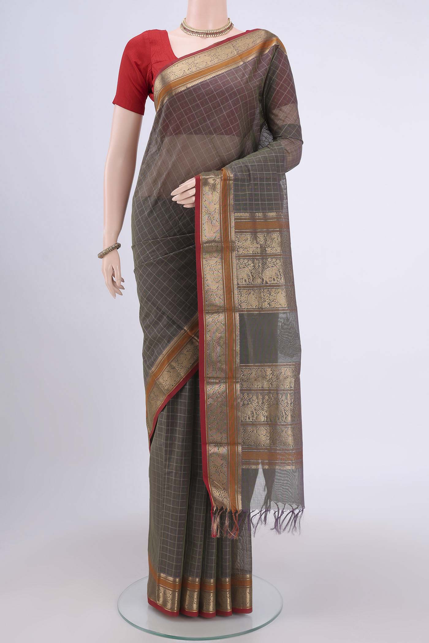 Grey Kanchi Cotton Saree with Checked design on the body and Zari Border.  displayed on a mannequin