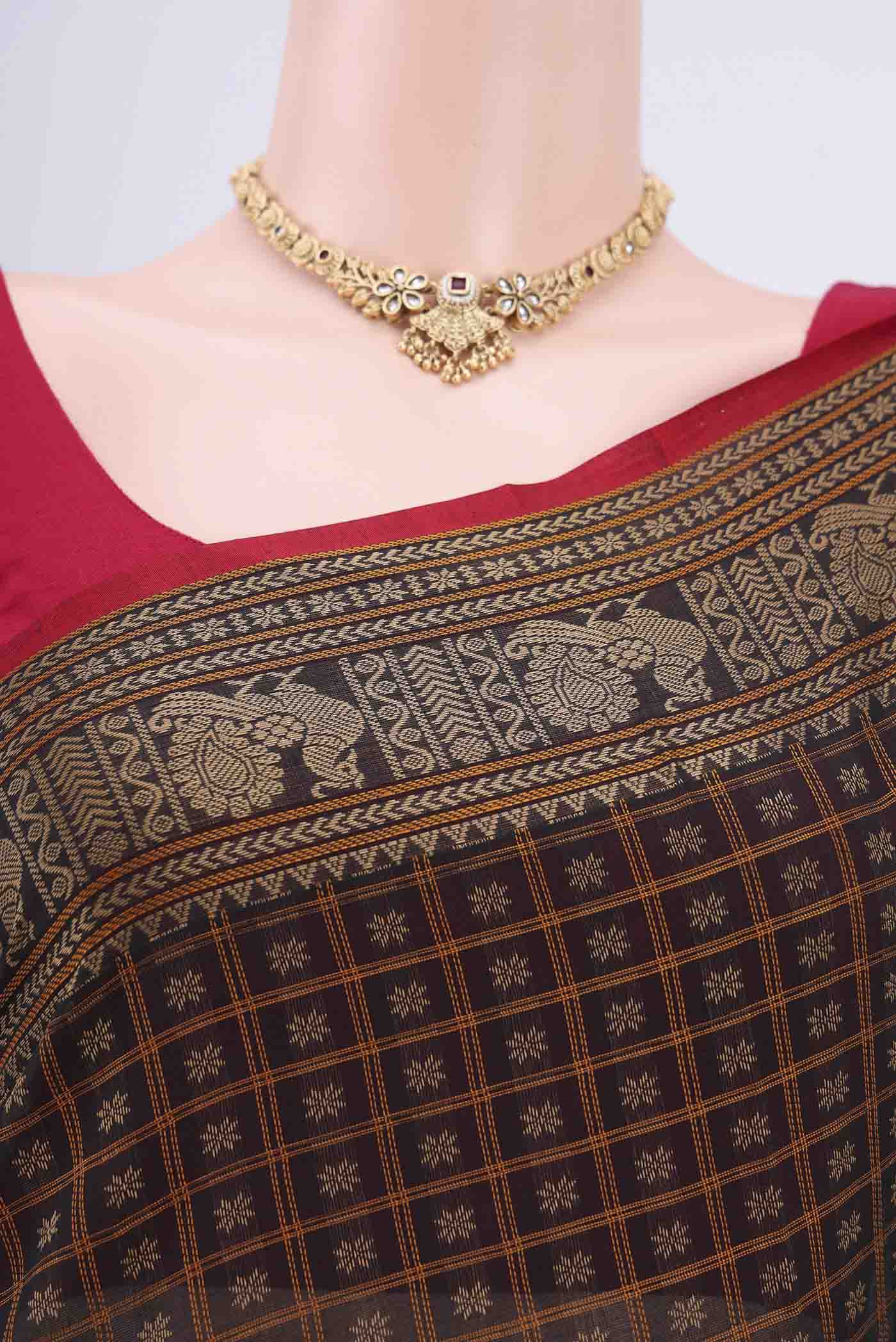 Border image of Black Kanchi Cotton Saree with Checked design on the body and Zari Border. 