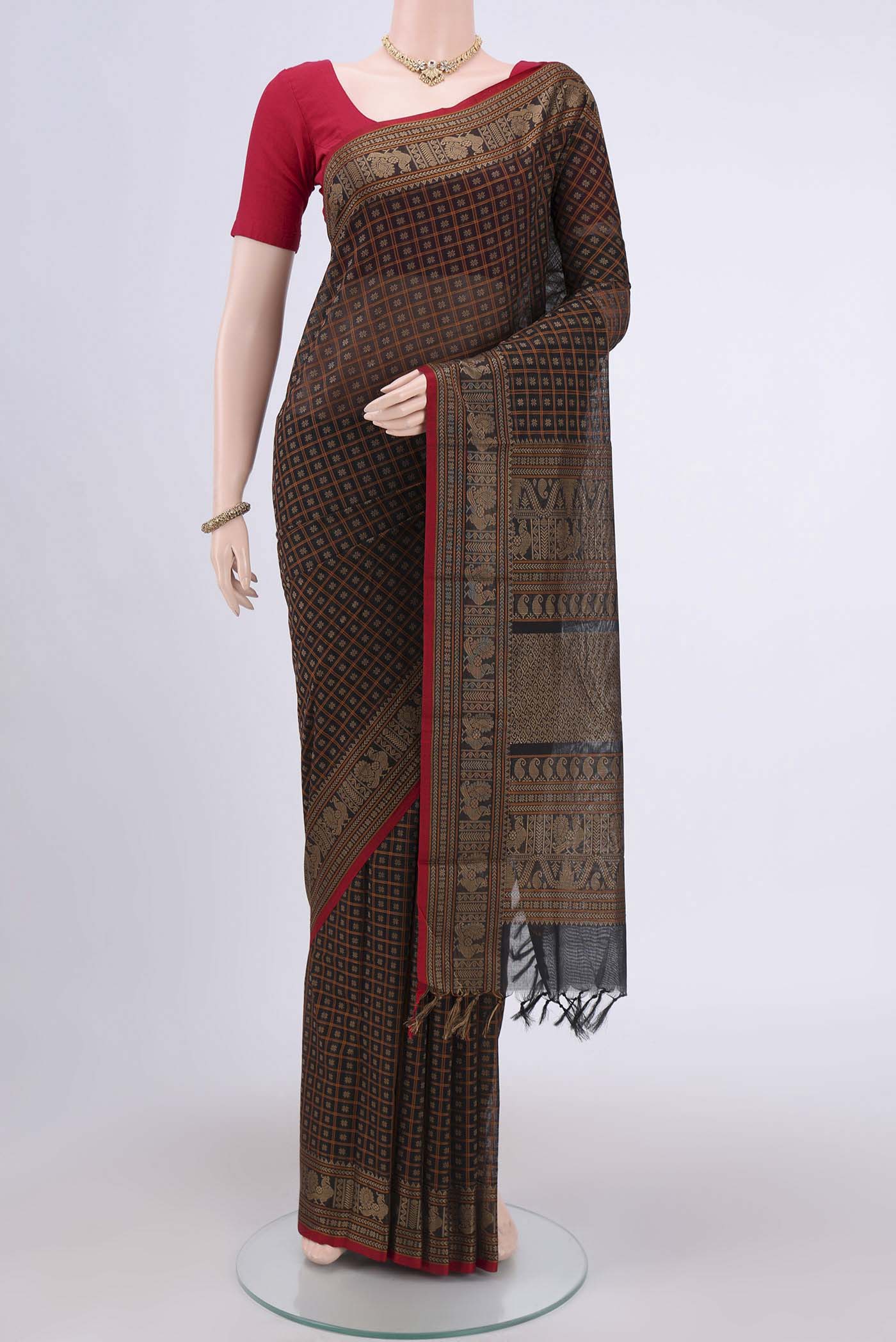 Black Kanchi Cotton Saree with Checked design on the body and Zari Border.  displayed on a mannequin