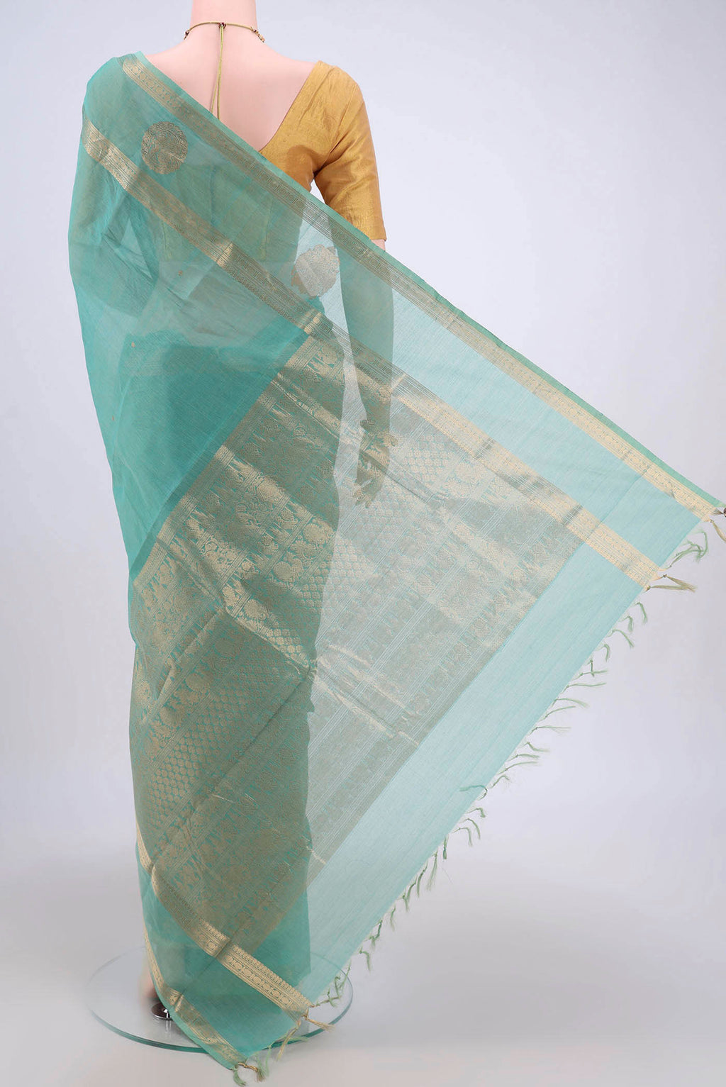Flat view of Turquoise Kanchi Cotton Saree with Zari Butta on the body and Zari Border. 