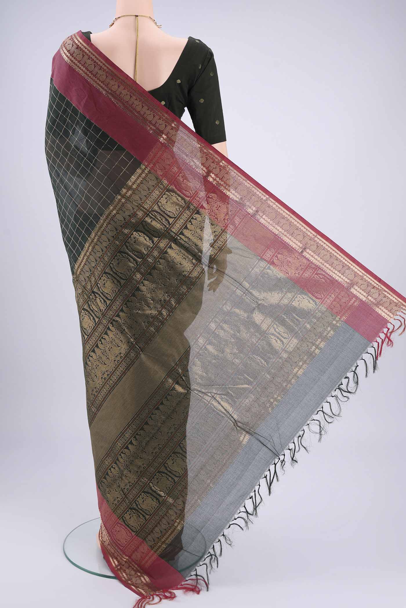 Flat view of Bottle Green Kanchi Cotton Saree with Checked design on the body and Zari Border. 