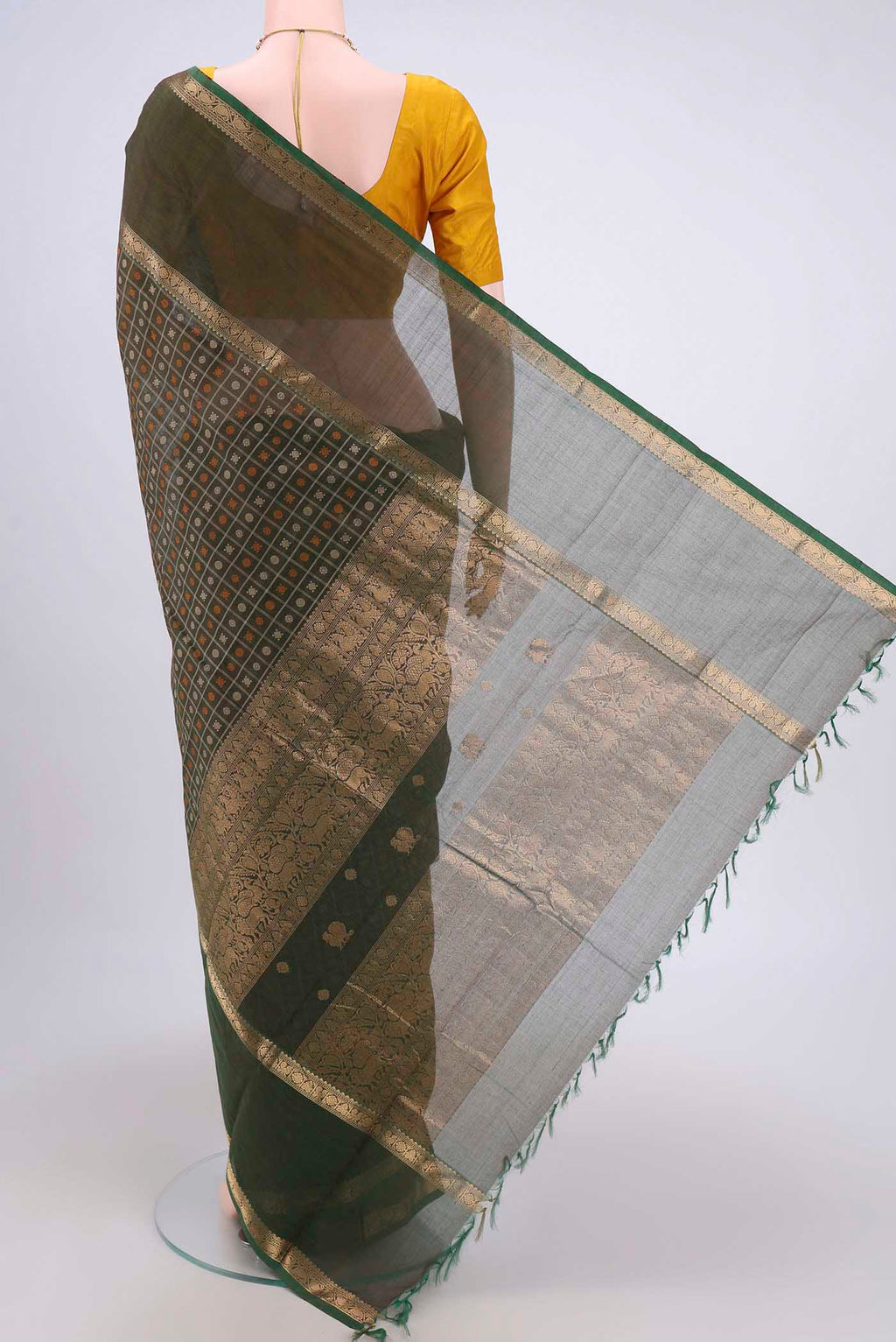 Flat view of Green Kanchi Cotton Saree with Checked design on the body and Zari Border. 