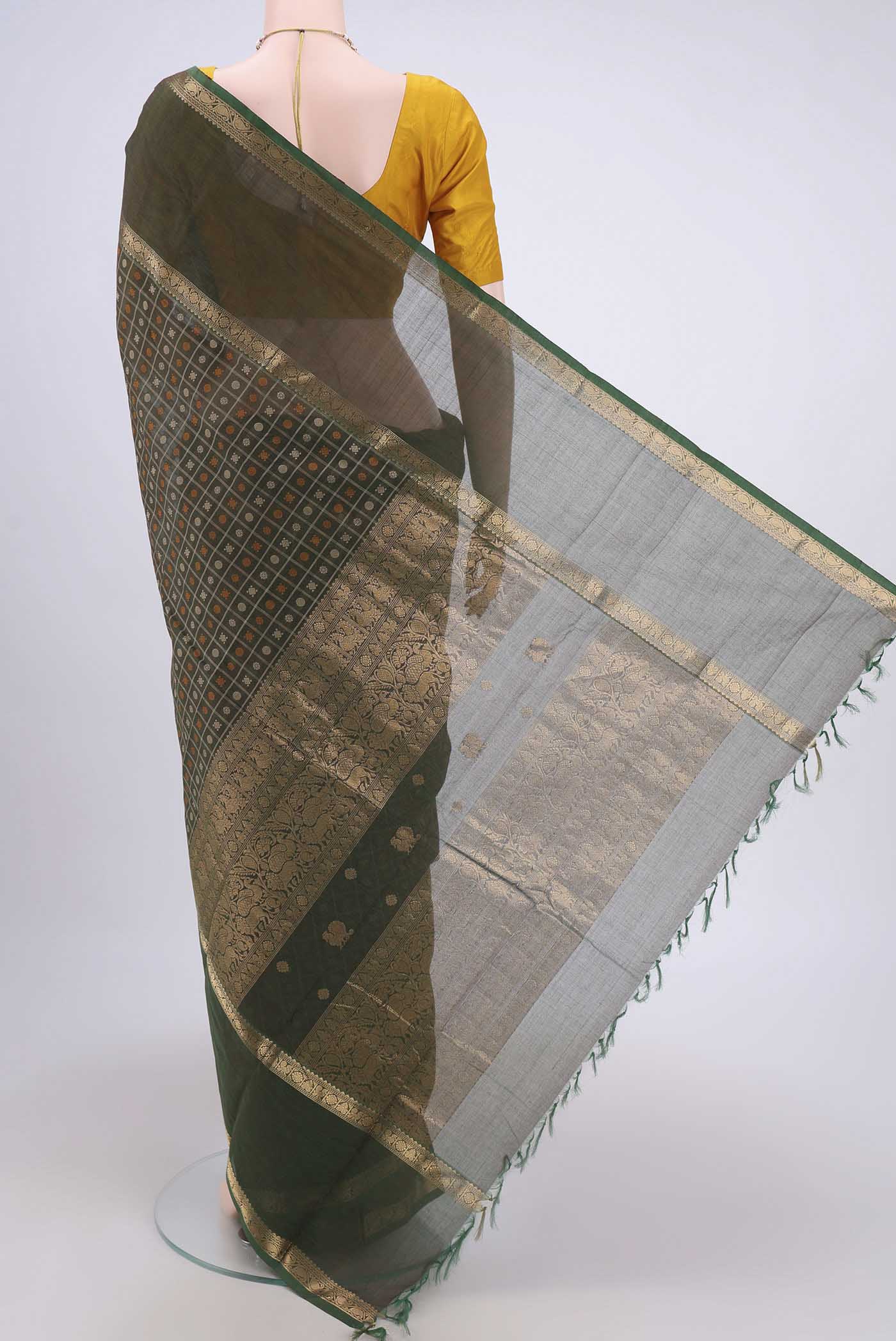Flat view of Green Kanchi Cotton Saree with Checked design on the body and Zari Border. 