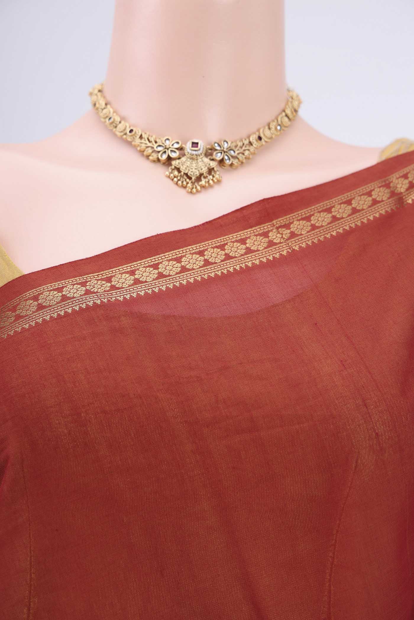 Border image of Maroon Kanchi Cotton Saree with Checked design on the body and Zari Border. 