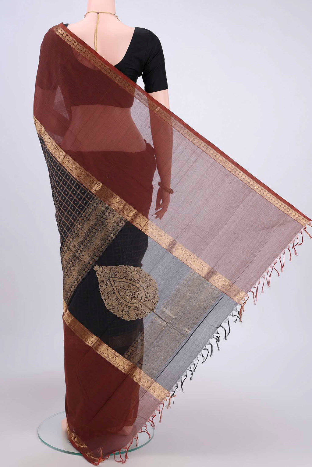 Flat view of Black Kanchi Cotton Saree with Checked design on the body and Zari Border. 