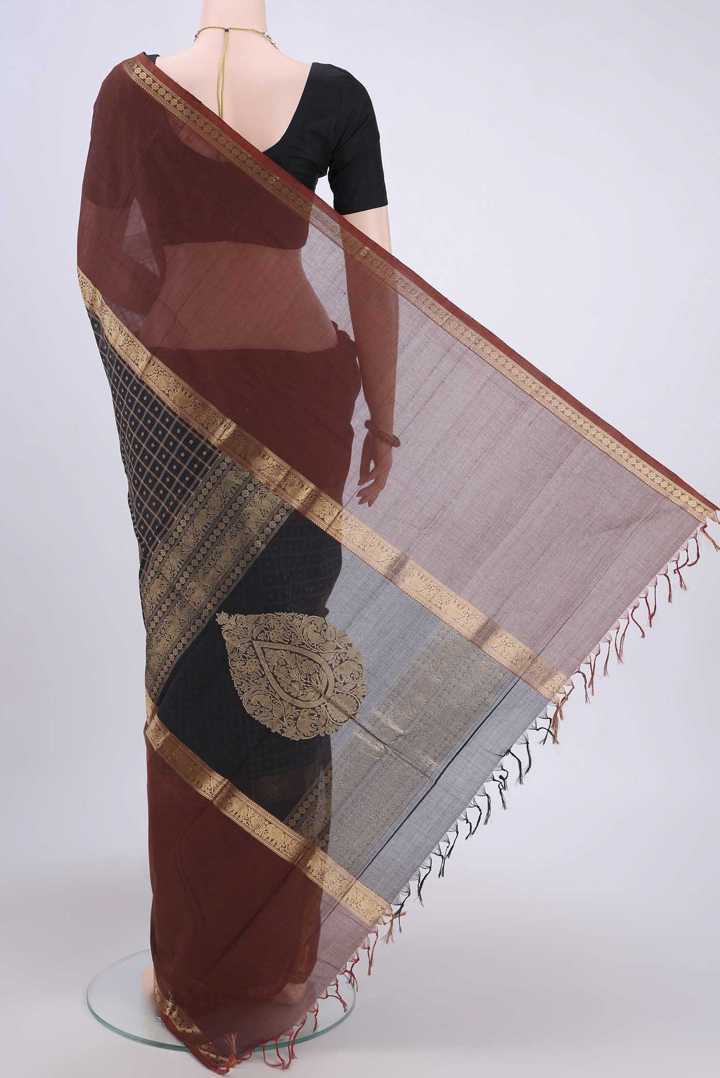 Flat view of Black Kanchi Cotton Saree with Checked design on the body and Zari Border. 