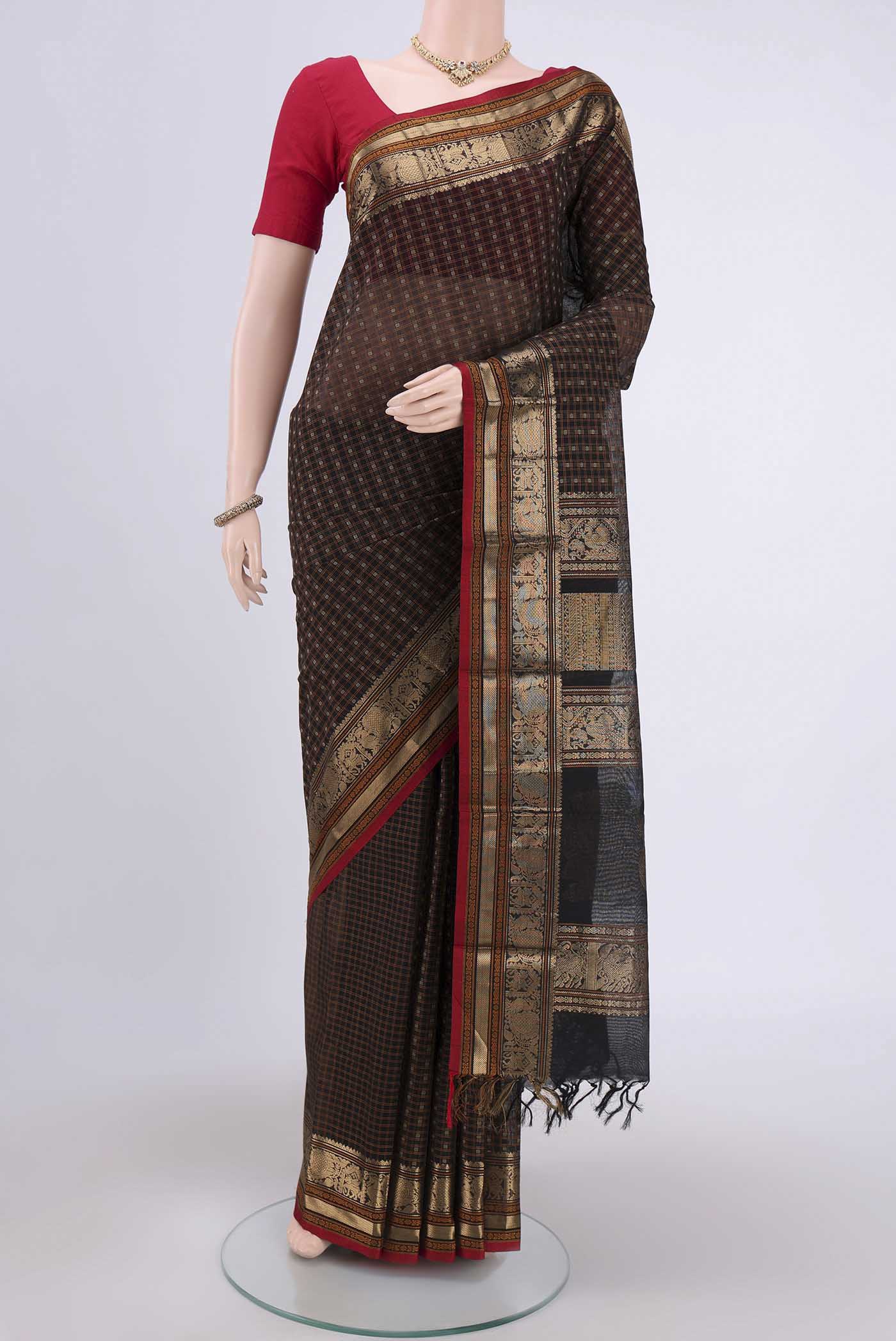 Black Kanchi Cotton Saree with Checked design on the body and Zari Border.  displayed on a mannequin