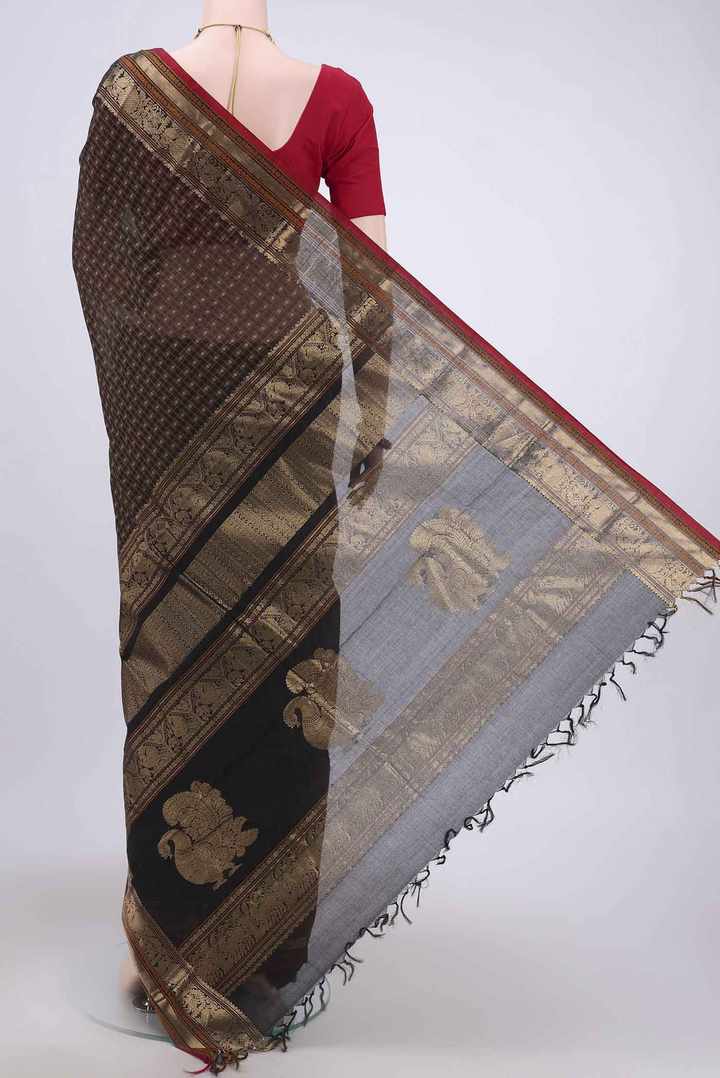 Flat view of Black Kanchi Cotton Saree with Checked design on the body and Zari Border. 