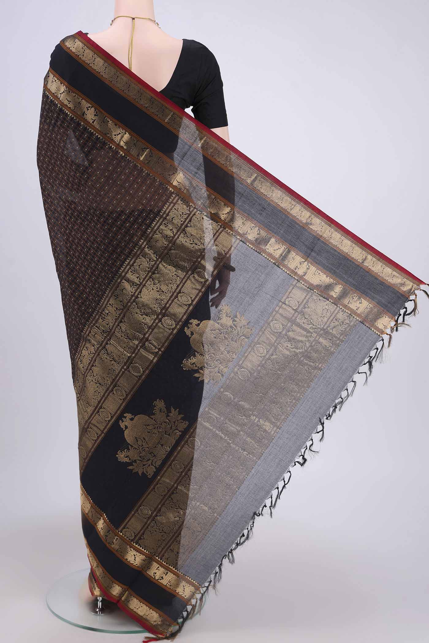 Flat view of Black Kanchi Cotton Saree with Checked design on the body and Zari Border. 
