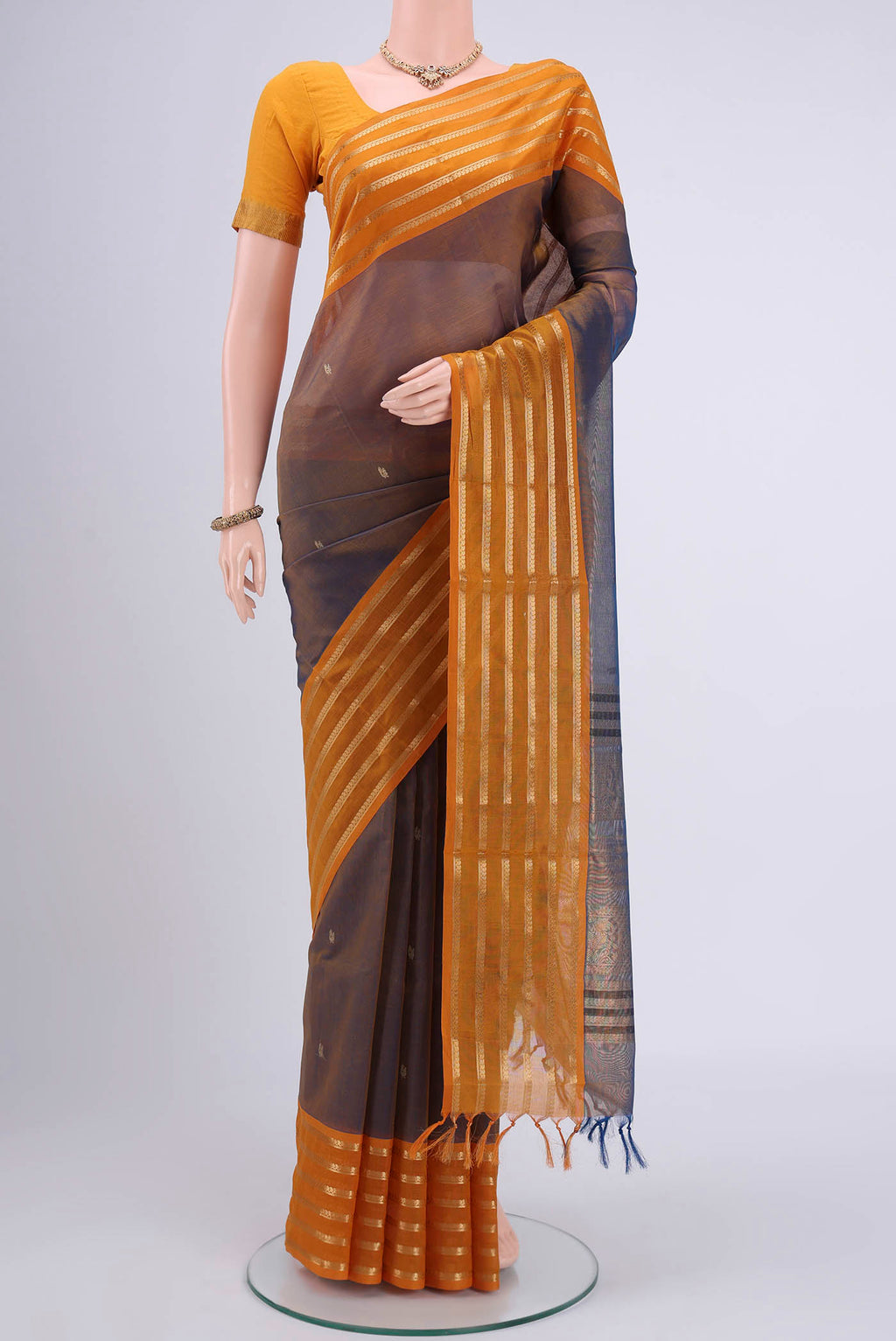 Brown Dual Tone Blended Coimbatore Silk Cotton Saree with Zari Butta on the body and Zari Border.  displayed on a mannequin